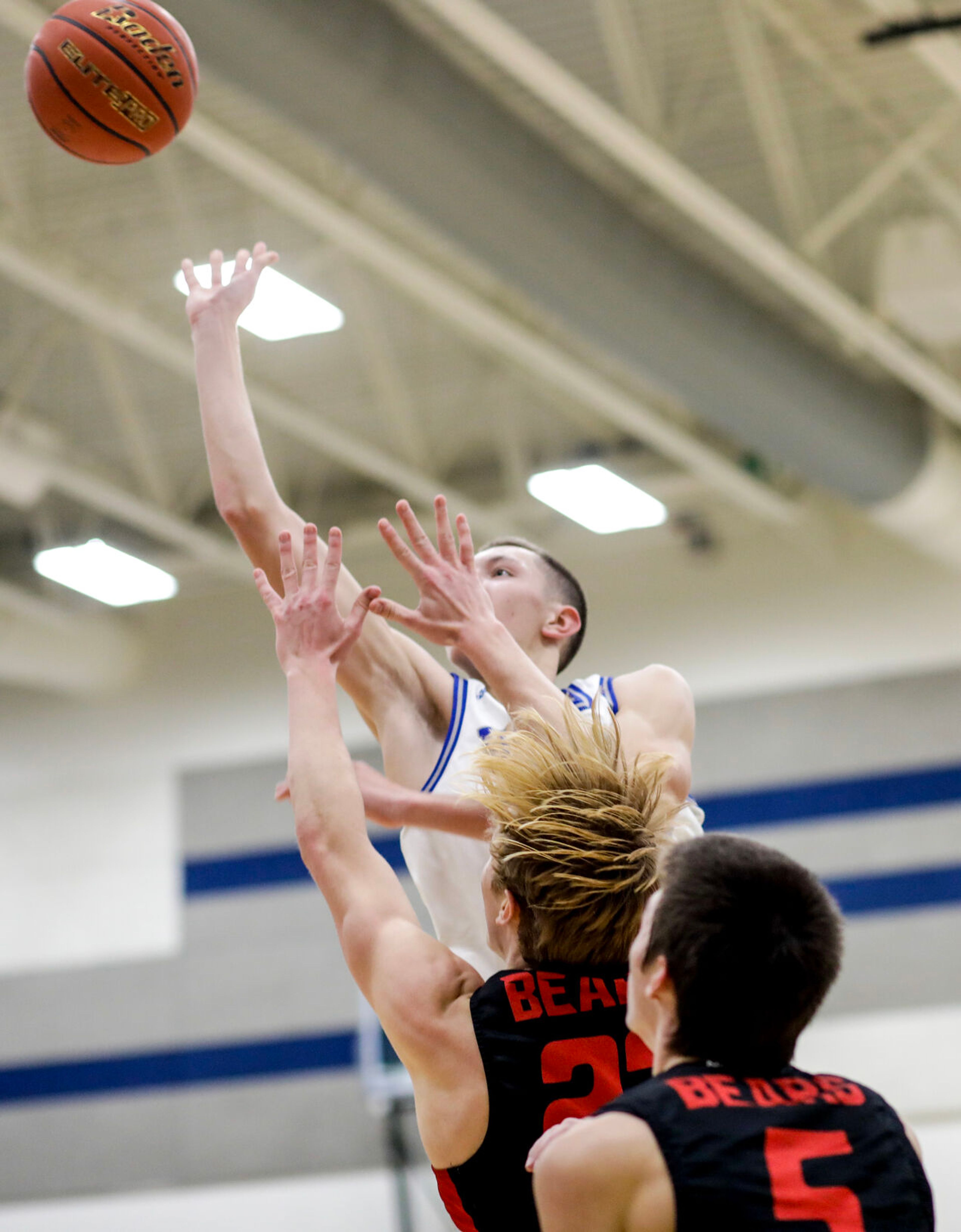 Pullman small forward Dane Sykes, back, shoots during Saturday's nonleague boys basketball game against Moscow.