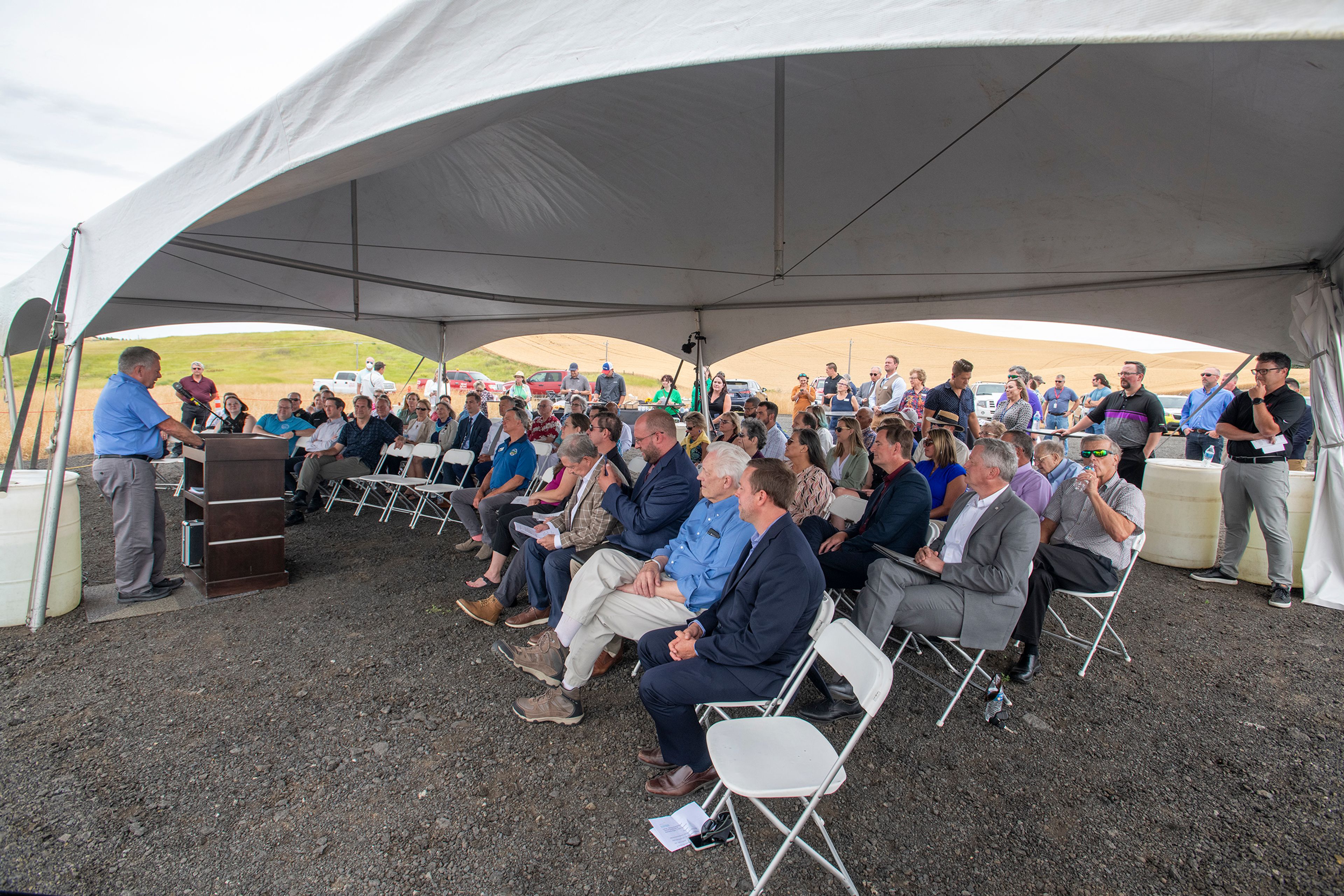 A crowd listens to Moscow Mayor Art Bettge speak at a groundbreaking event for the new Pullman-Moscow Regional Airport terminal.