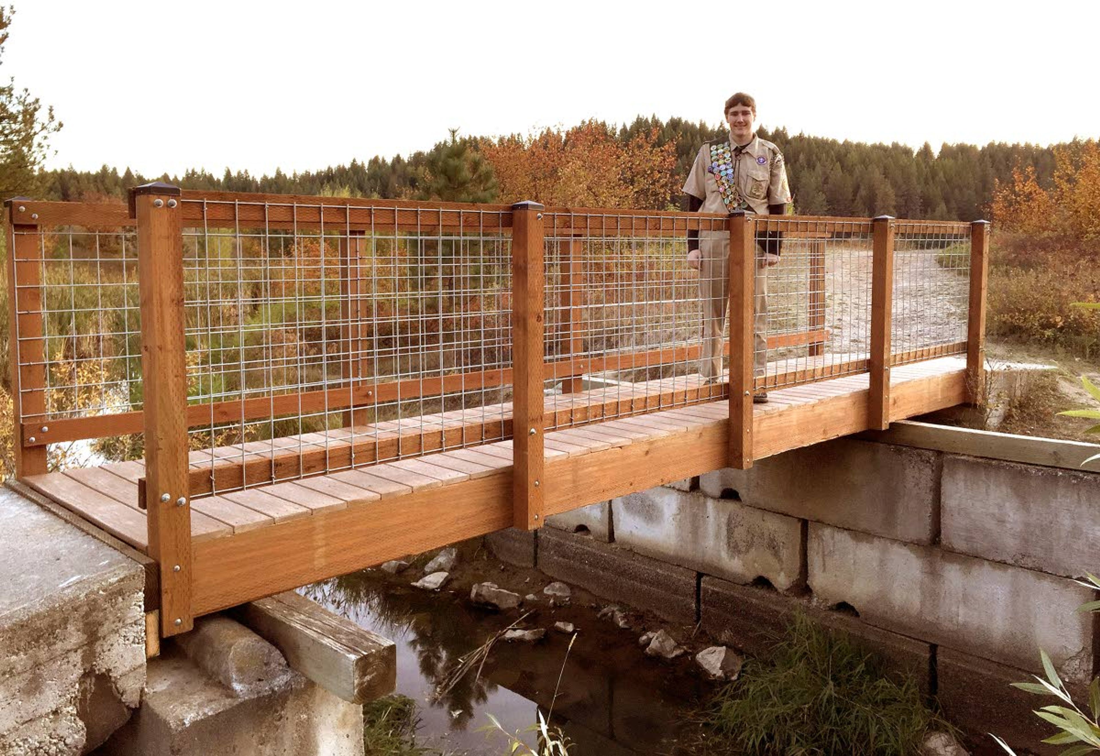 Jeremiah Wheeler of Moscow stands on the Spring Valley Reservoir footbridge, which he rebuilt for his Eagle Scout project.