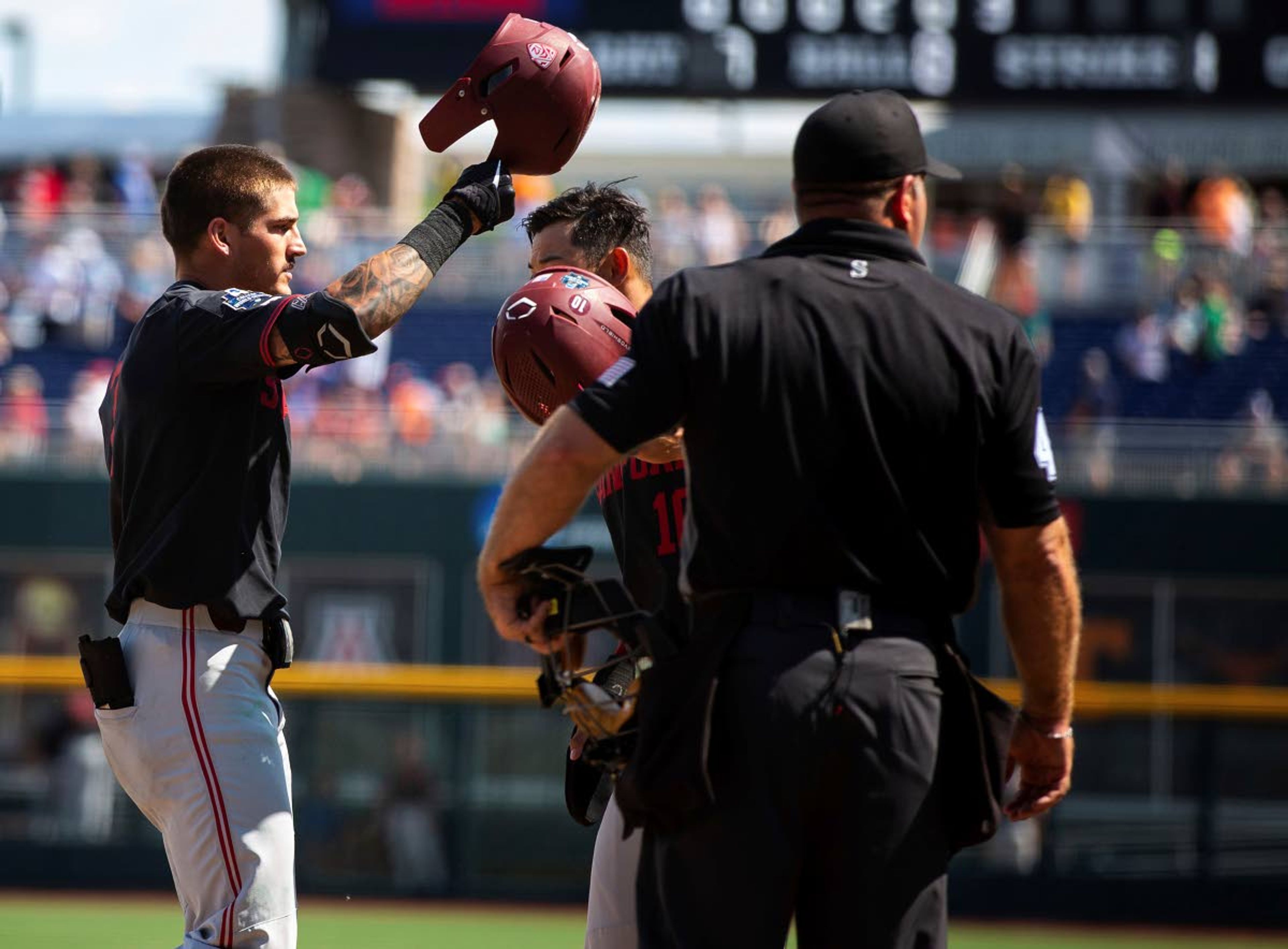 Stanford's Brock Jones, left, celebrates with Adam Crampton (10) after hitting a three-run home run against Arizona in the seventh inning during a baseball game in the College World Series, Monday, June 21, 2021, at TD Ameritrade Park in Omaha, Neb. (AP Photo/Rebecca S. Gratz)