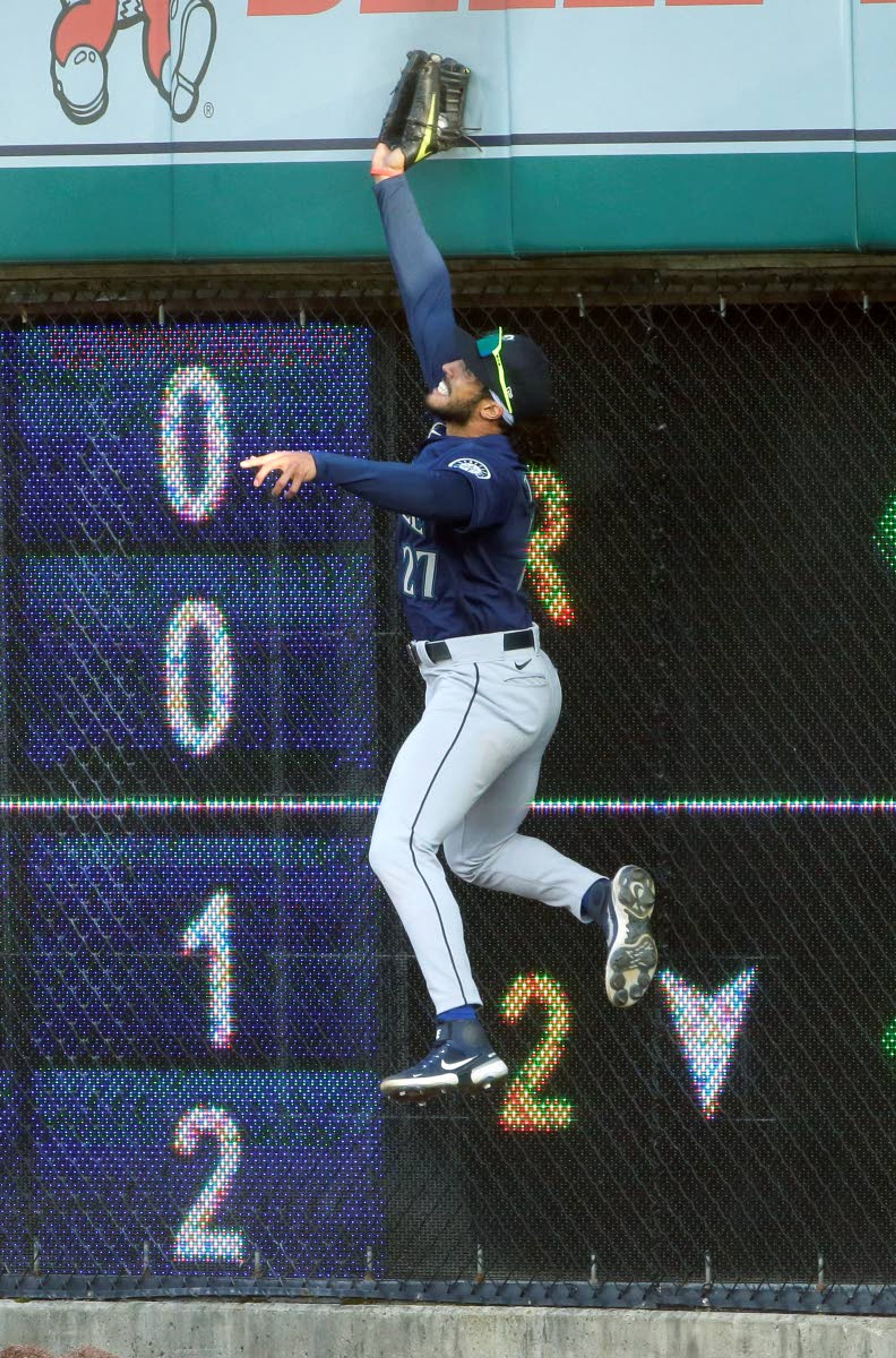 Seattle Mariners right fielder Dillon Thomas goes up against the scoreboard to catch a fly ball hit by Detroit Tigers' Niko Goodrum during the second inning of a baseball game Wednesday, June 9, 2021, in Detroit. (AP Photo/Duane Burleson)