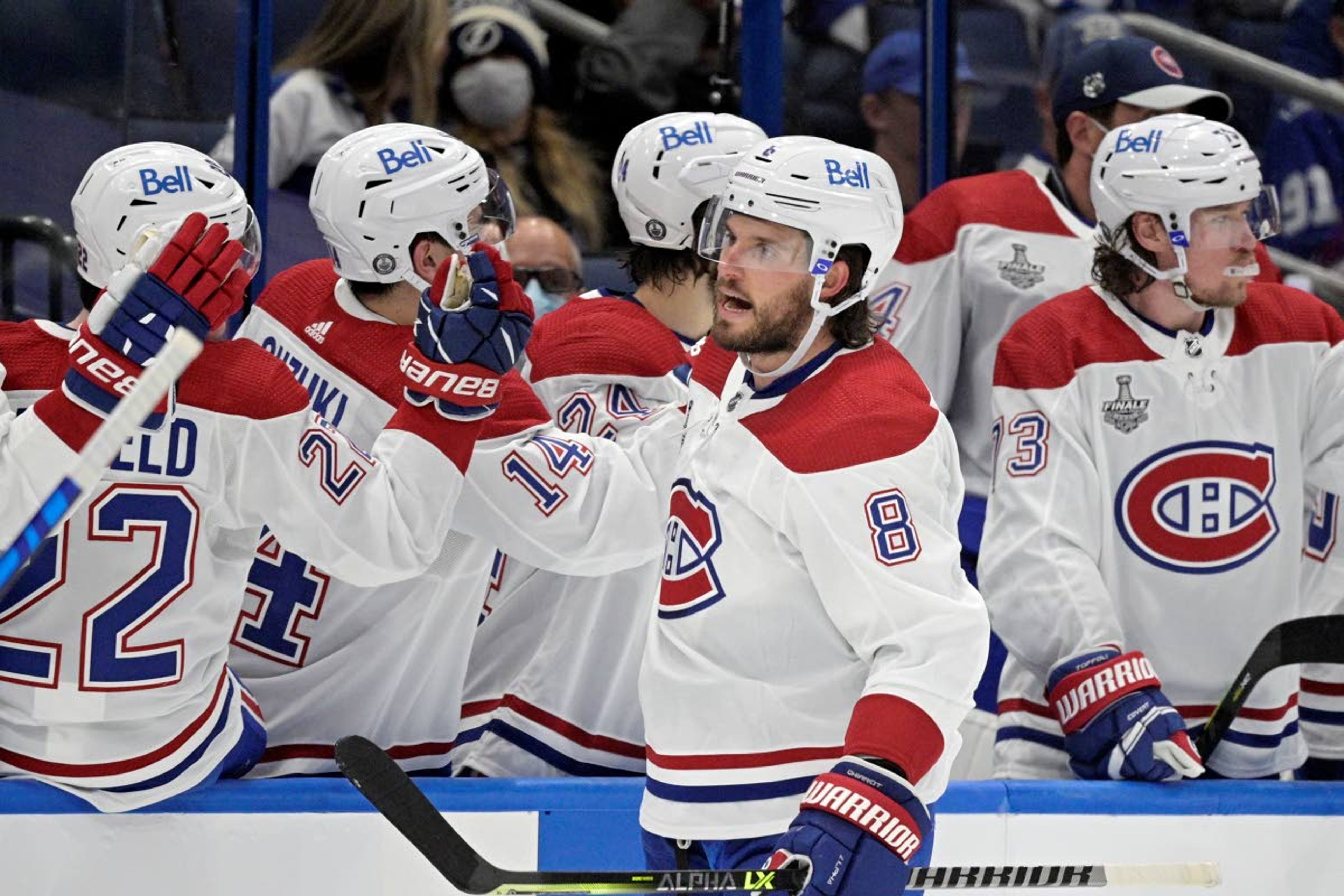 Montreal Canadiens defenseman Ben Chiarot (8) is congratulated by teammates after scoring during the second period in Game 1 of the NHL hockey Stanley Cup finals against the Tampa Bay Lightning, Monday, June 28, 2021, in Tampa, Fla. (AP Photo/Phelan Ebenhack)