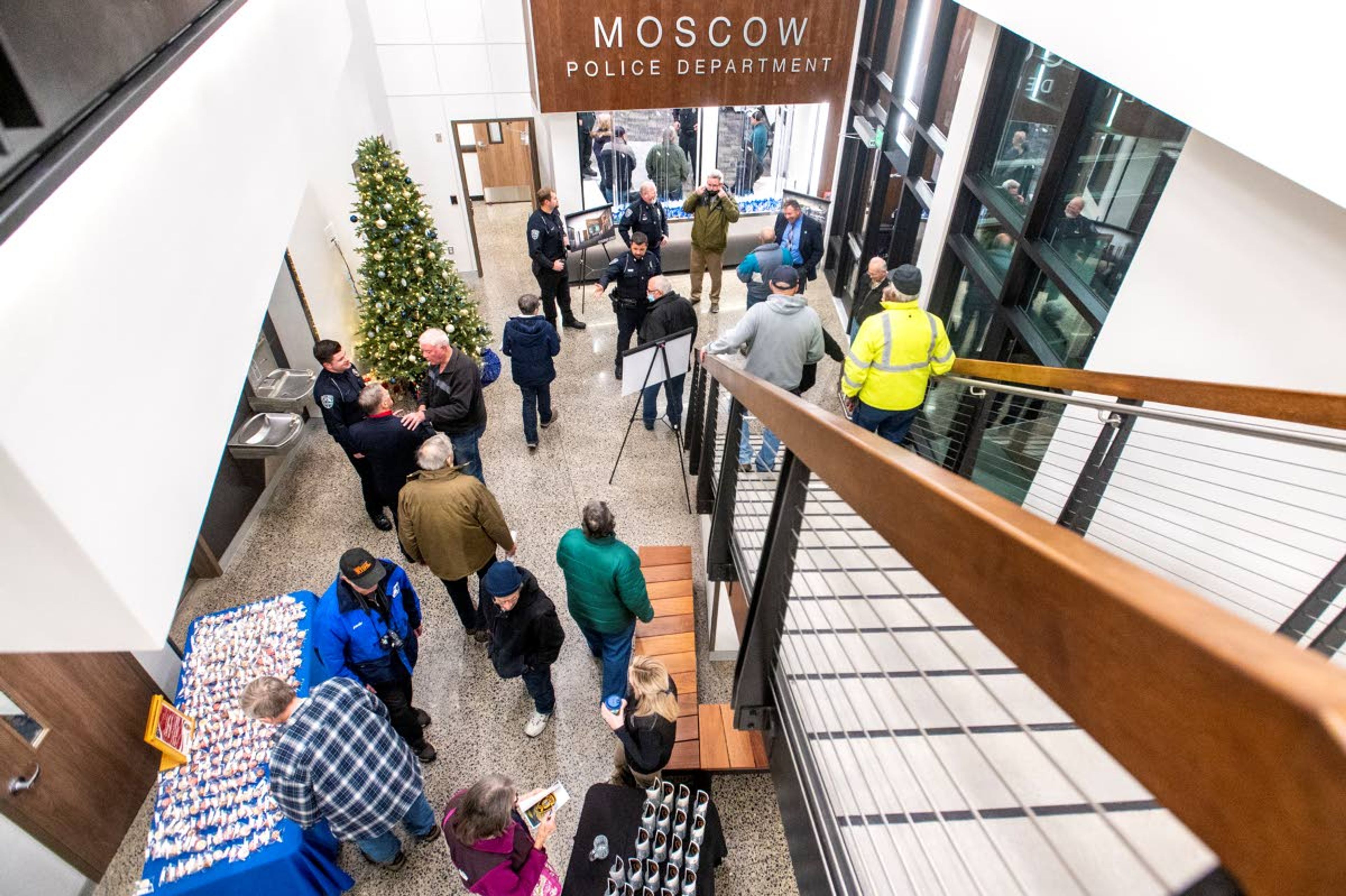 Visitors gather in the lobby of the new police station station for a tour.