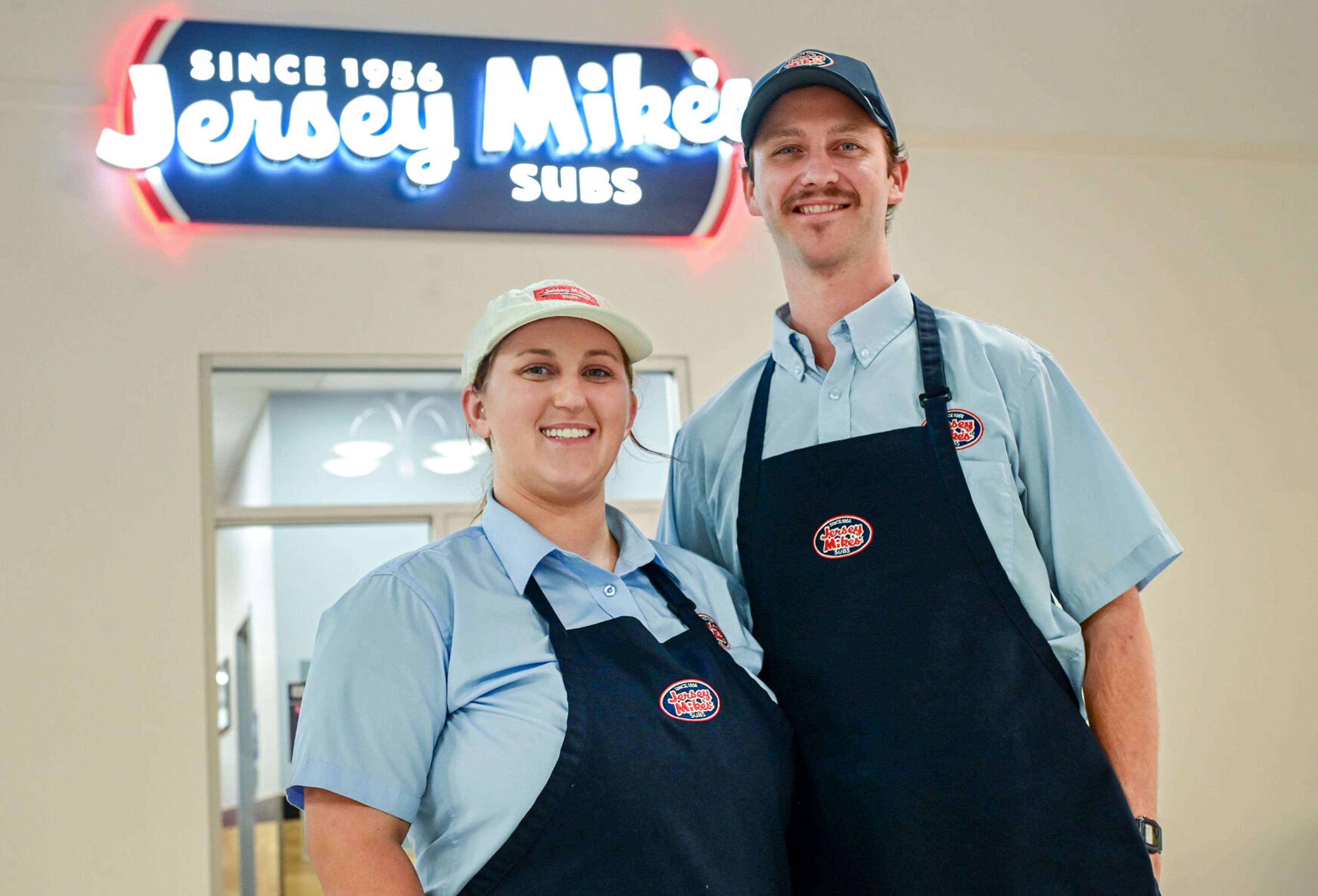 Alanah Dutka, left, and Cooper Rodgers, owner and operators of the new Jersey Mike's Subs, stand by the back entrance of the sub shop on Tuesday in Moscow.