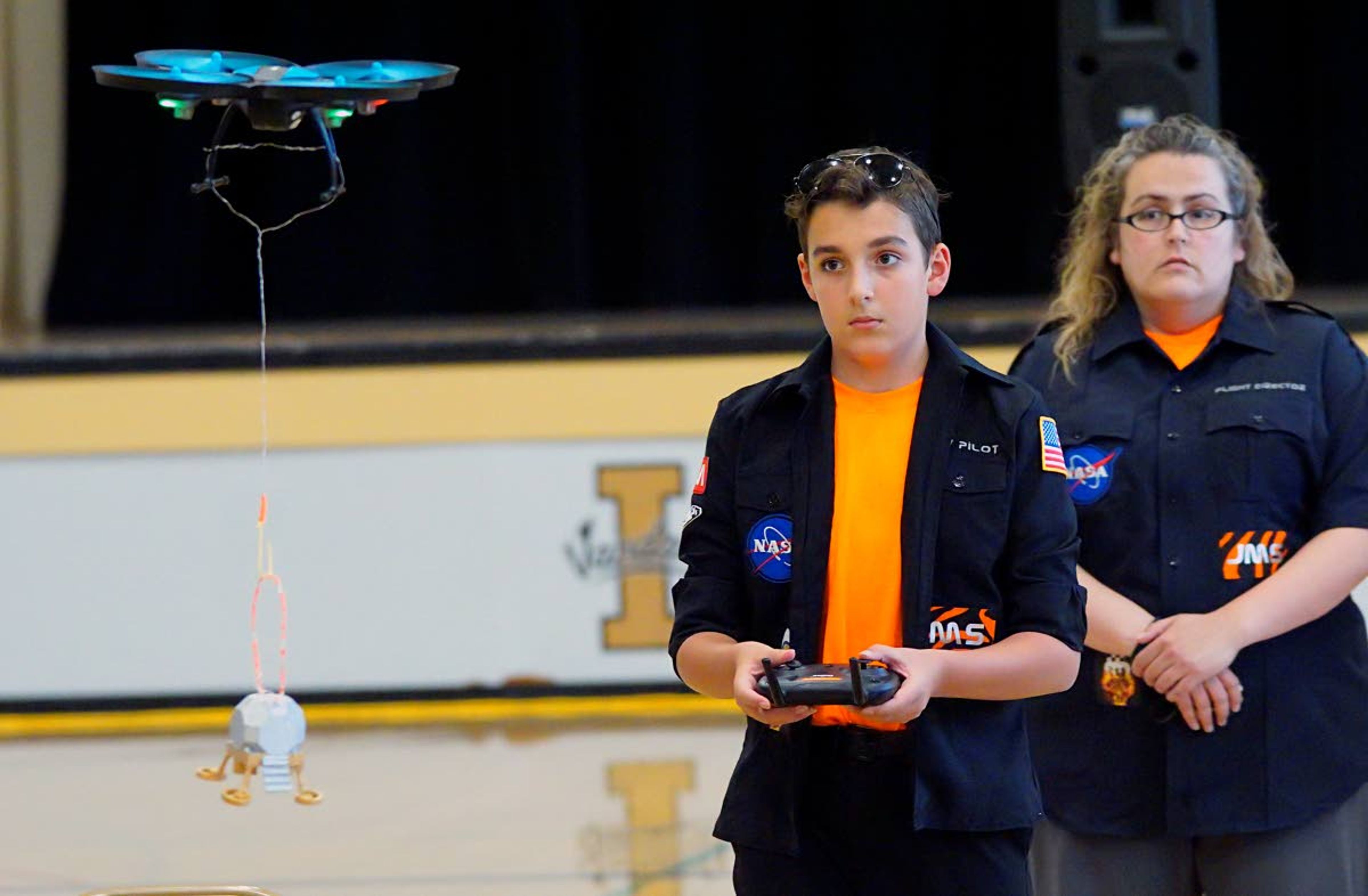 Isaac Steele, of Jerome, pilots a drone carrying a model of a lunar lander to a landing zone on a map of the moon during NASA’s Apollo Next Giant Leap Student Challenge at the University of Idaho on Tuesday.