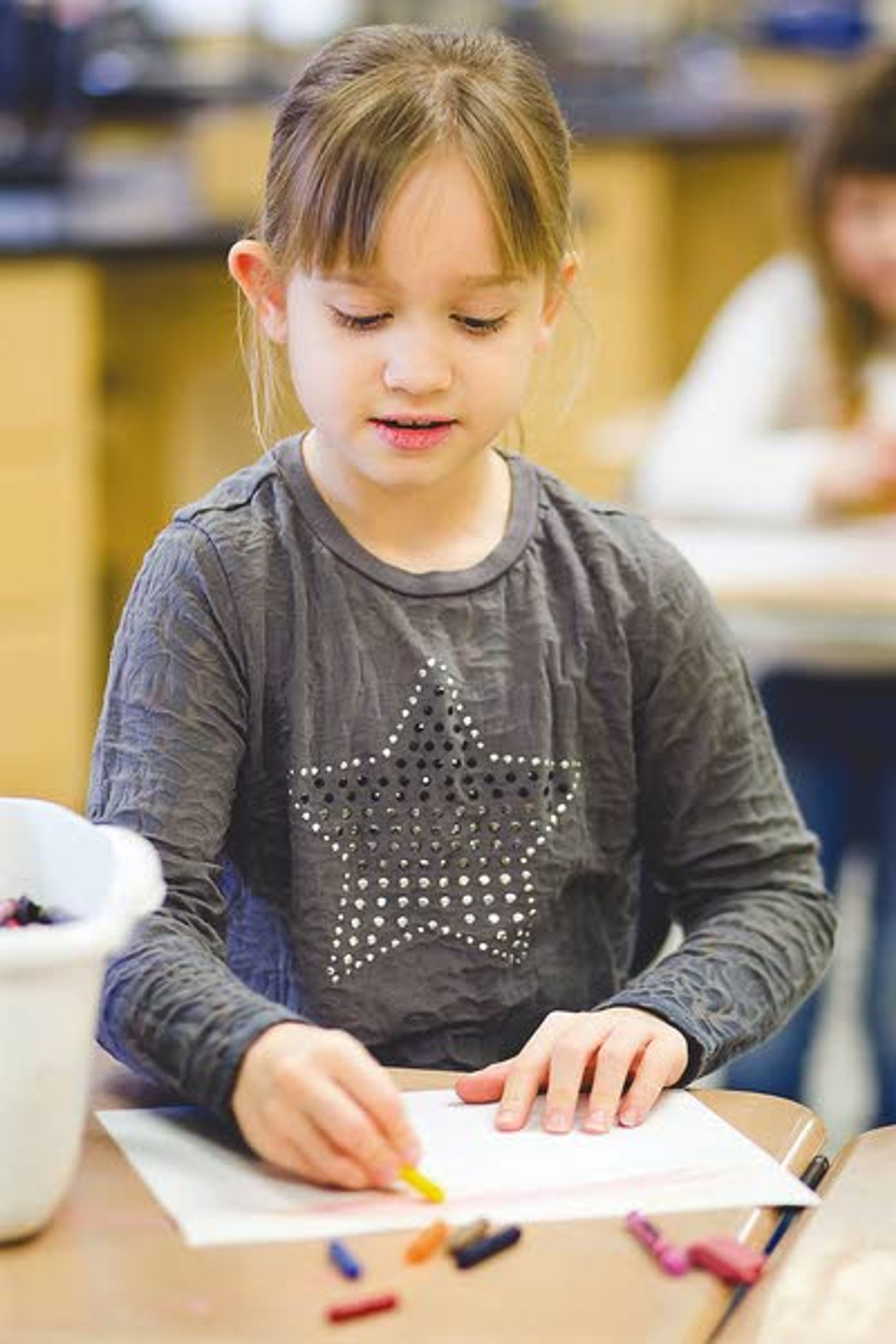 Third-grader Jessica Holmes colors a zen doodle at Genesee School. Holmes participates in the SPARK! Art Club at the school.