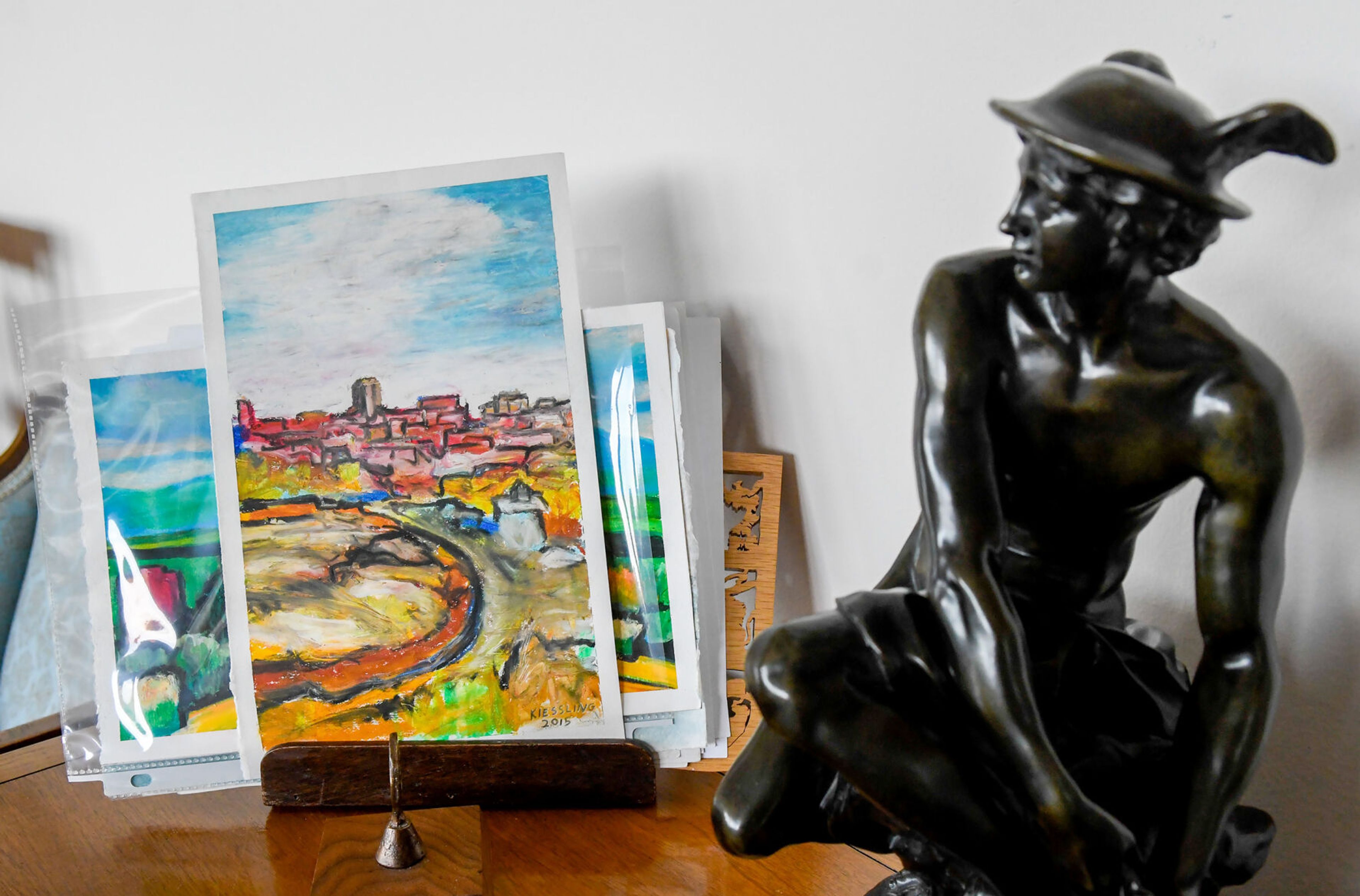 A few unique pastel works by Dan Kiessling are propped up on a side table of his parent’s home in Pullman on Tuesday.