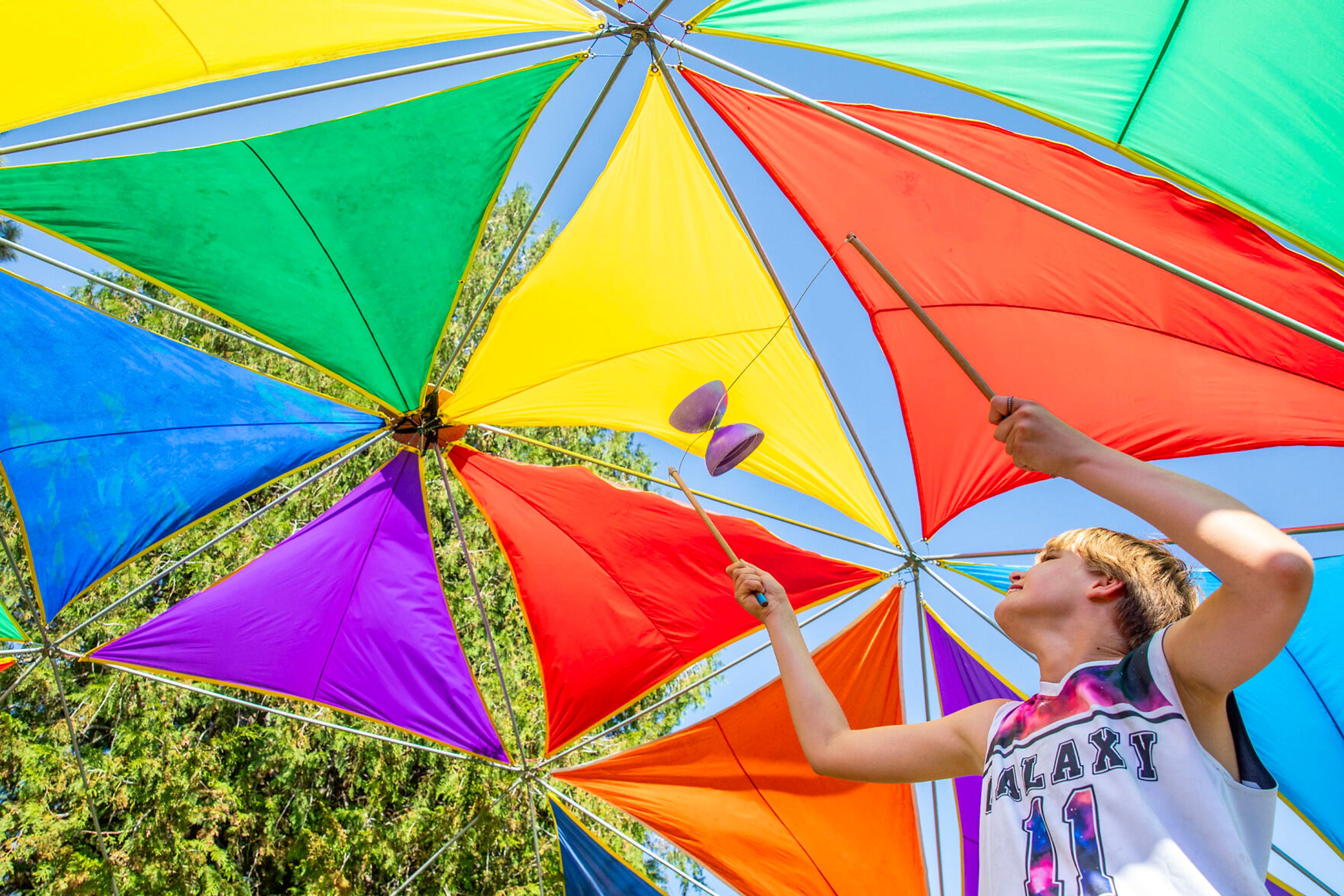 Chloe Gautreaux, 12, of Pullman, uses the Diablo stick at the Amazama Juggling School Saturday at Lentil fest in Reaney Park in Pullman.