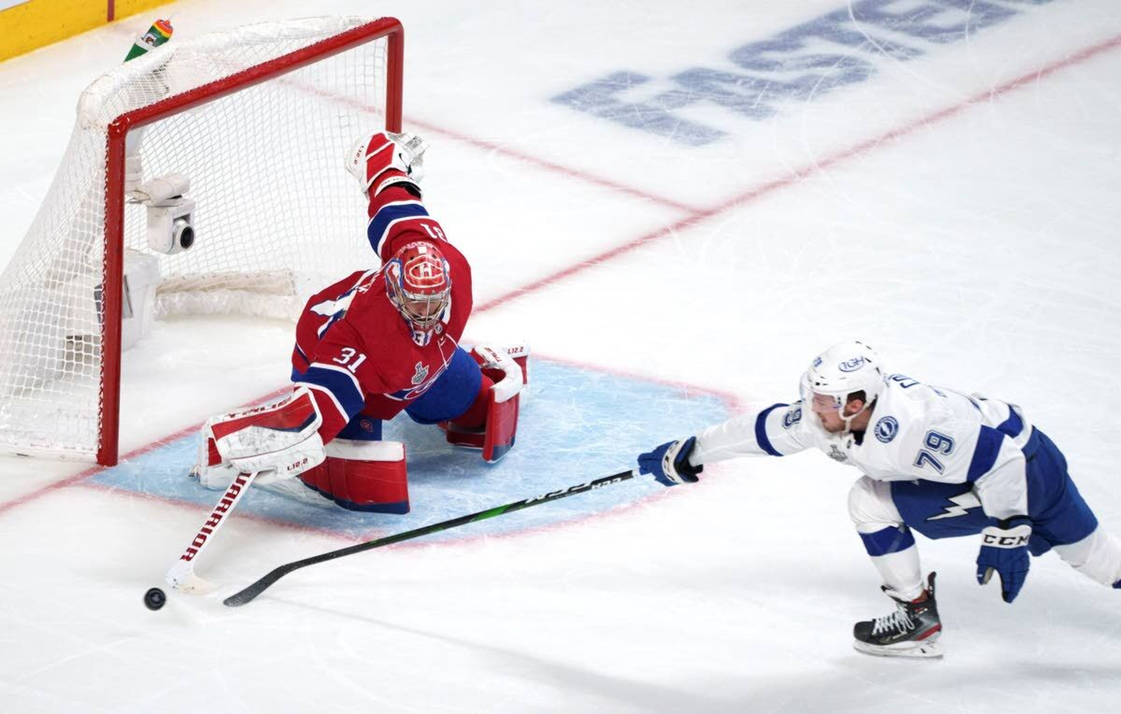 Montreal Canadiens goaltender Carey Price clears the puck away from Tampa Bay Lightning's Ross Colton (79) during the third period of Game 3 of the NHL hockey Stanley Cup Final, Friday, July 2, 2021, in Montreal. (Paul Chiasson/The Canadian Press via AP)