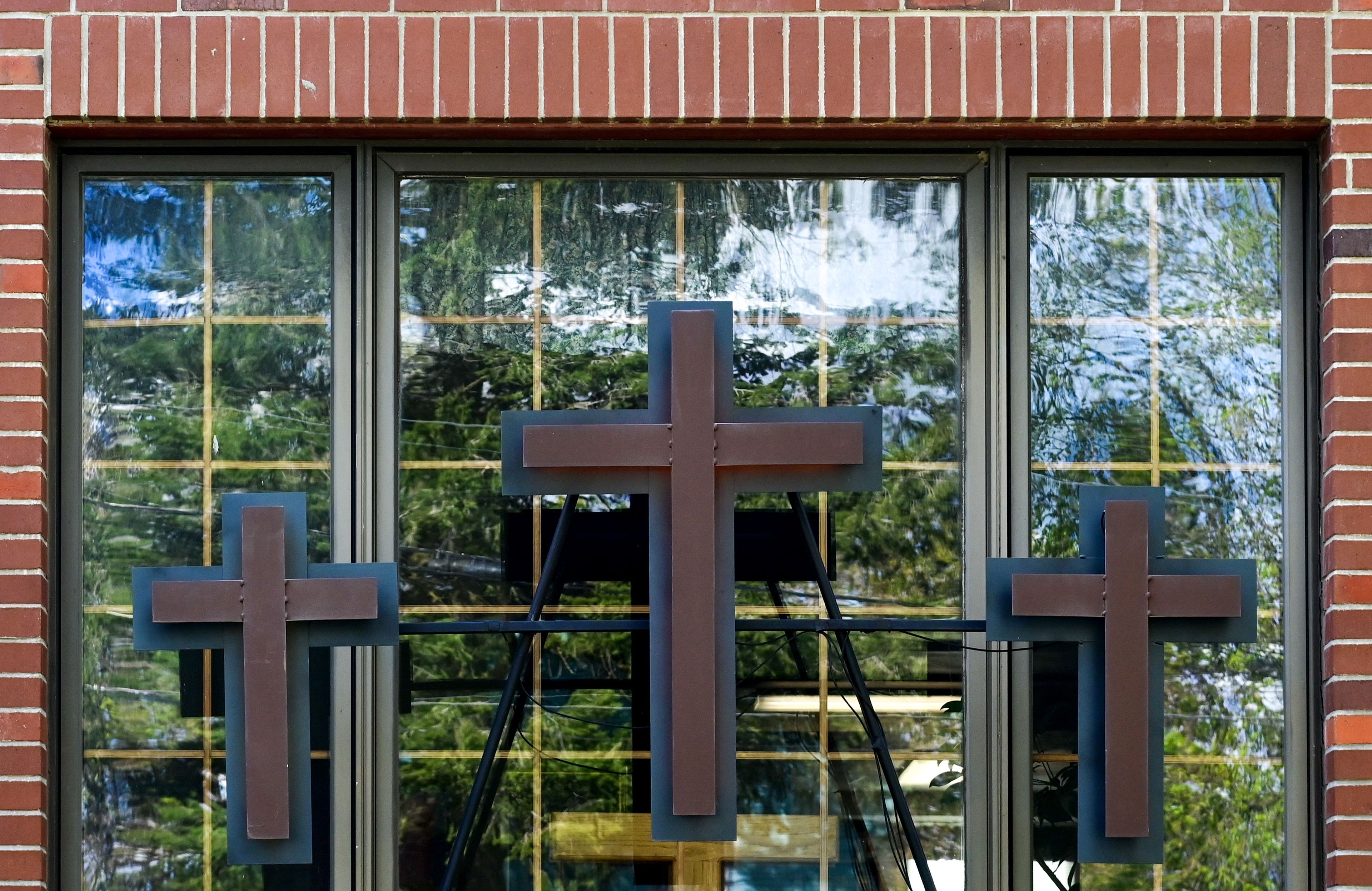 Three crosses hang from a window at First Presbyterian Church in Moscow on Wednesday.