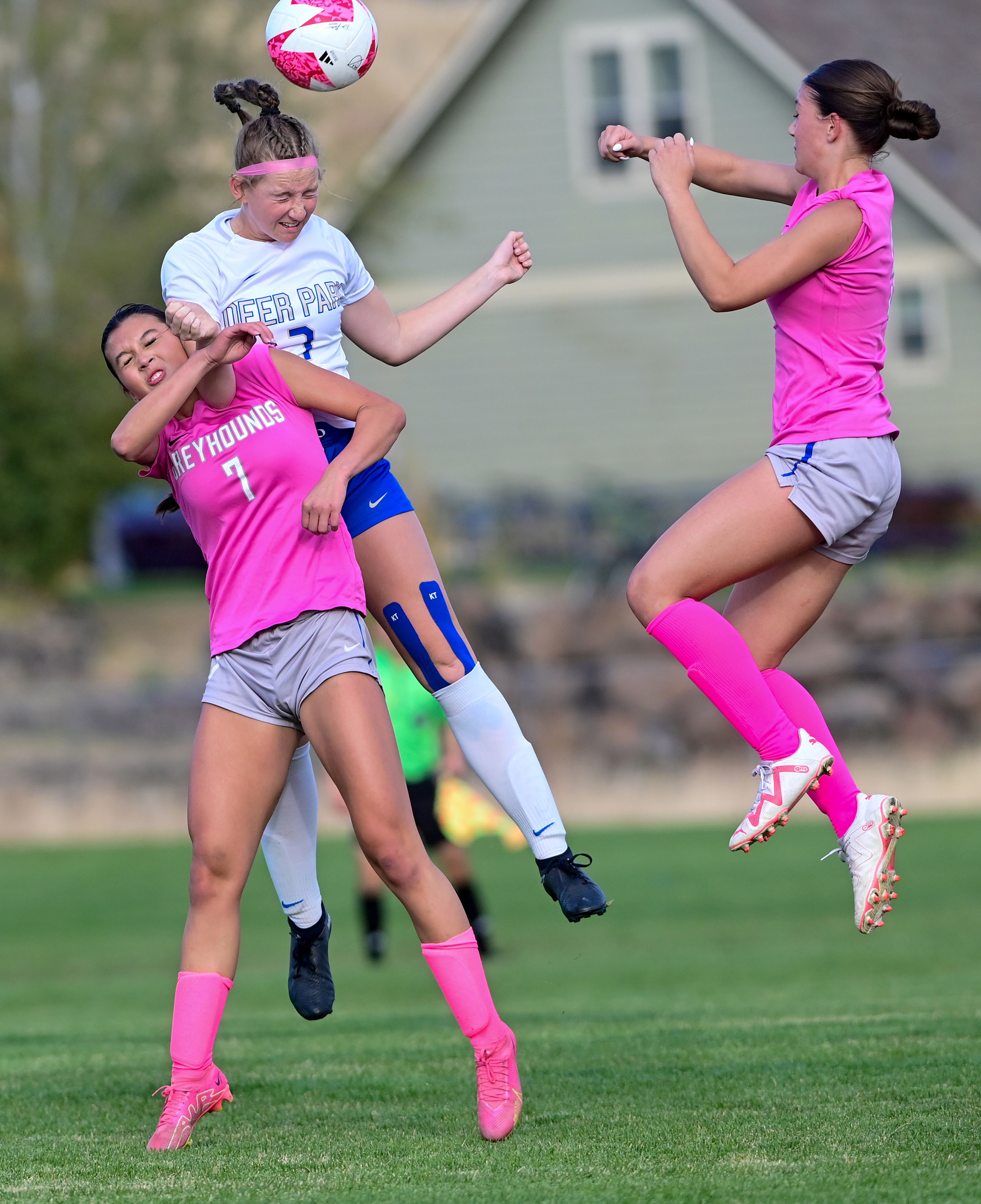 Pullman junior Sidney Johnson collides with Deer Park sophomore Lucy Lathrop as they jump to head the ball Thursday in Pullman.,