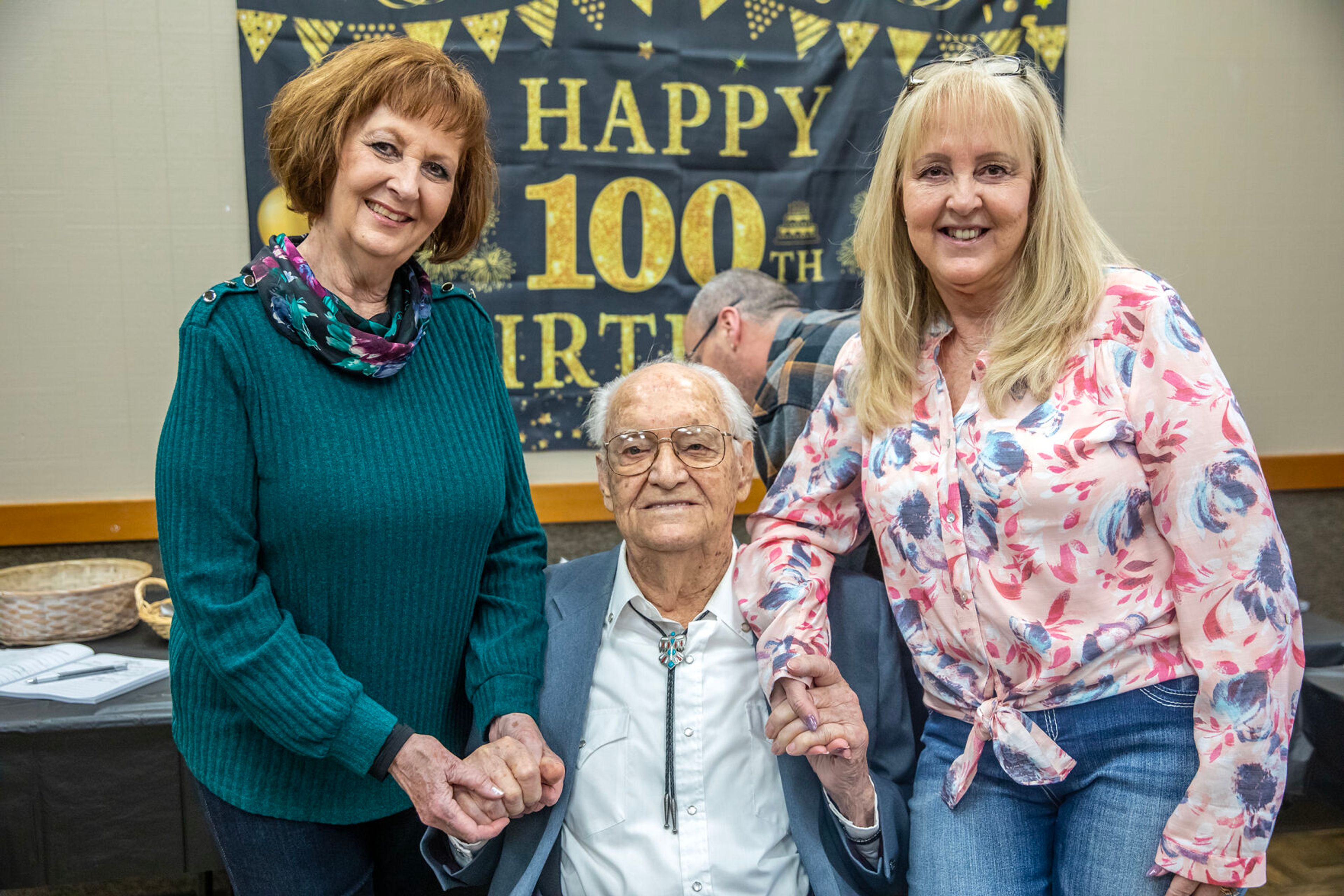 Floyd Thomason is pictured with his daughters Susan Hall, left, and Sharon Crocker, during his 100th birthday party Saturday at the Lewiston Community Center.