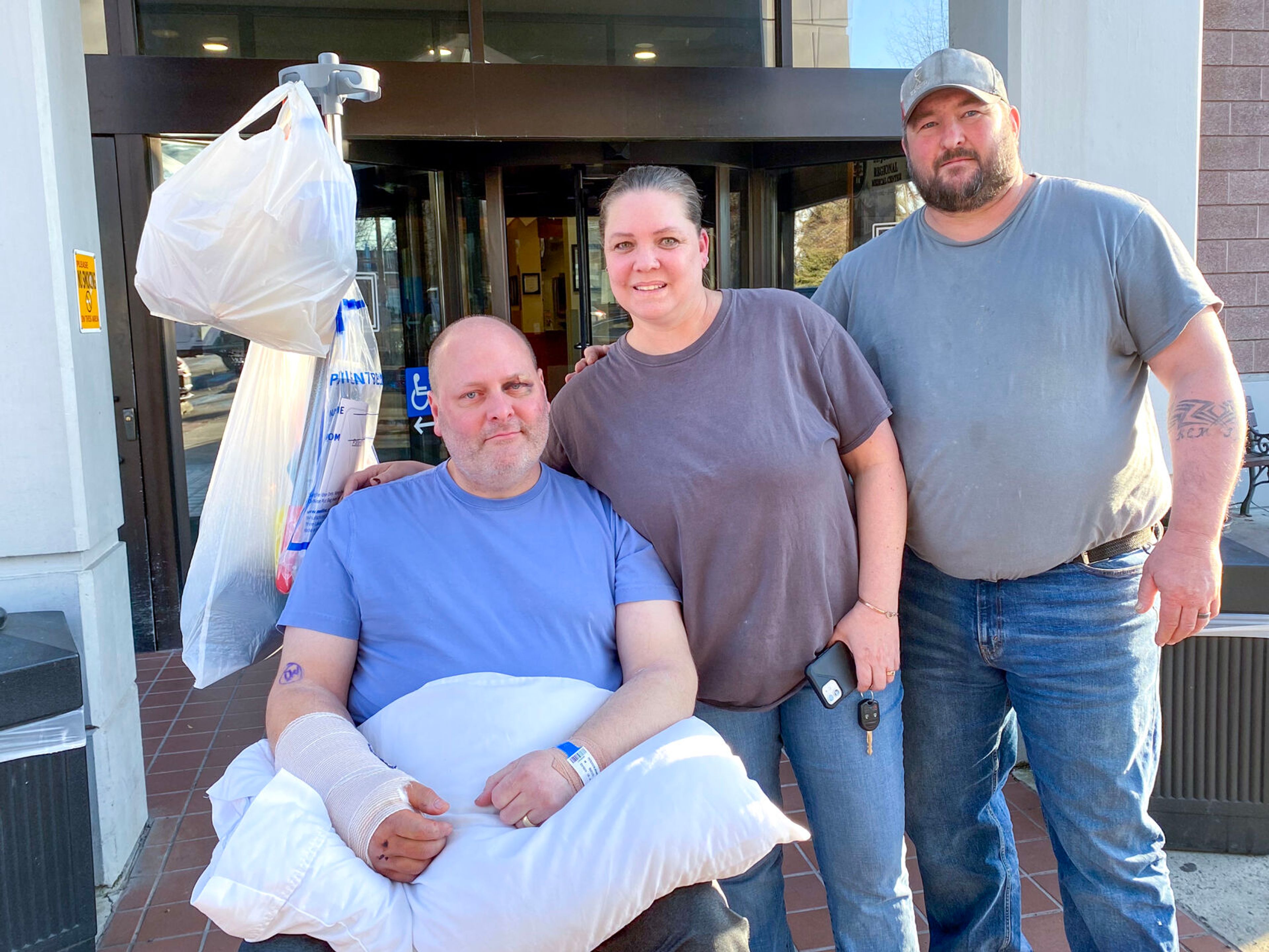 Brandon Petersen, the pilot of the plane is pictured with Lisa Montague and Justin Montague in front of St. Joseph Regional Medical Center in Lewiston.