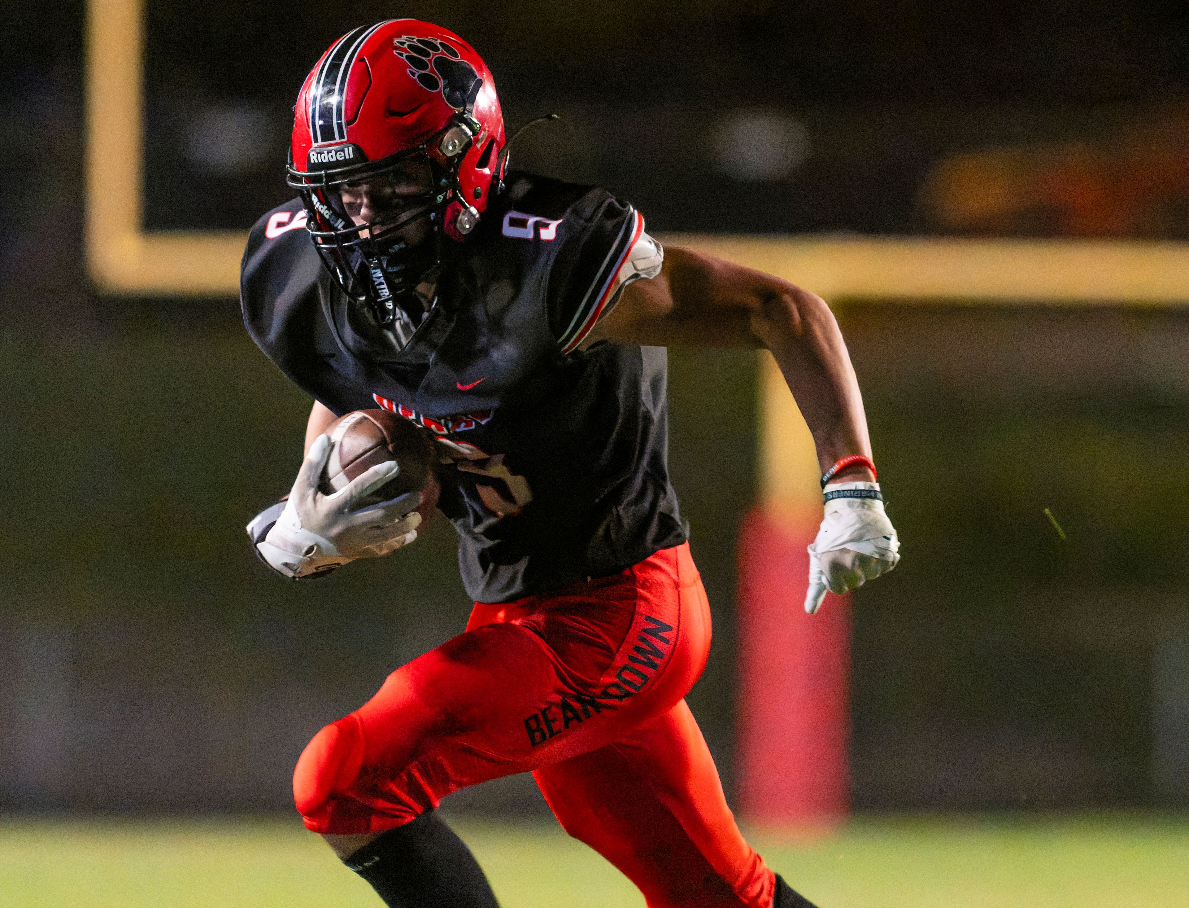 Moscow wide receiver Mason Helbling runs the ball during a game against the Bonners Ferry Badgers on Friday night at Bear Field in Moscow.