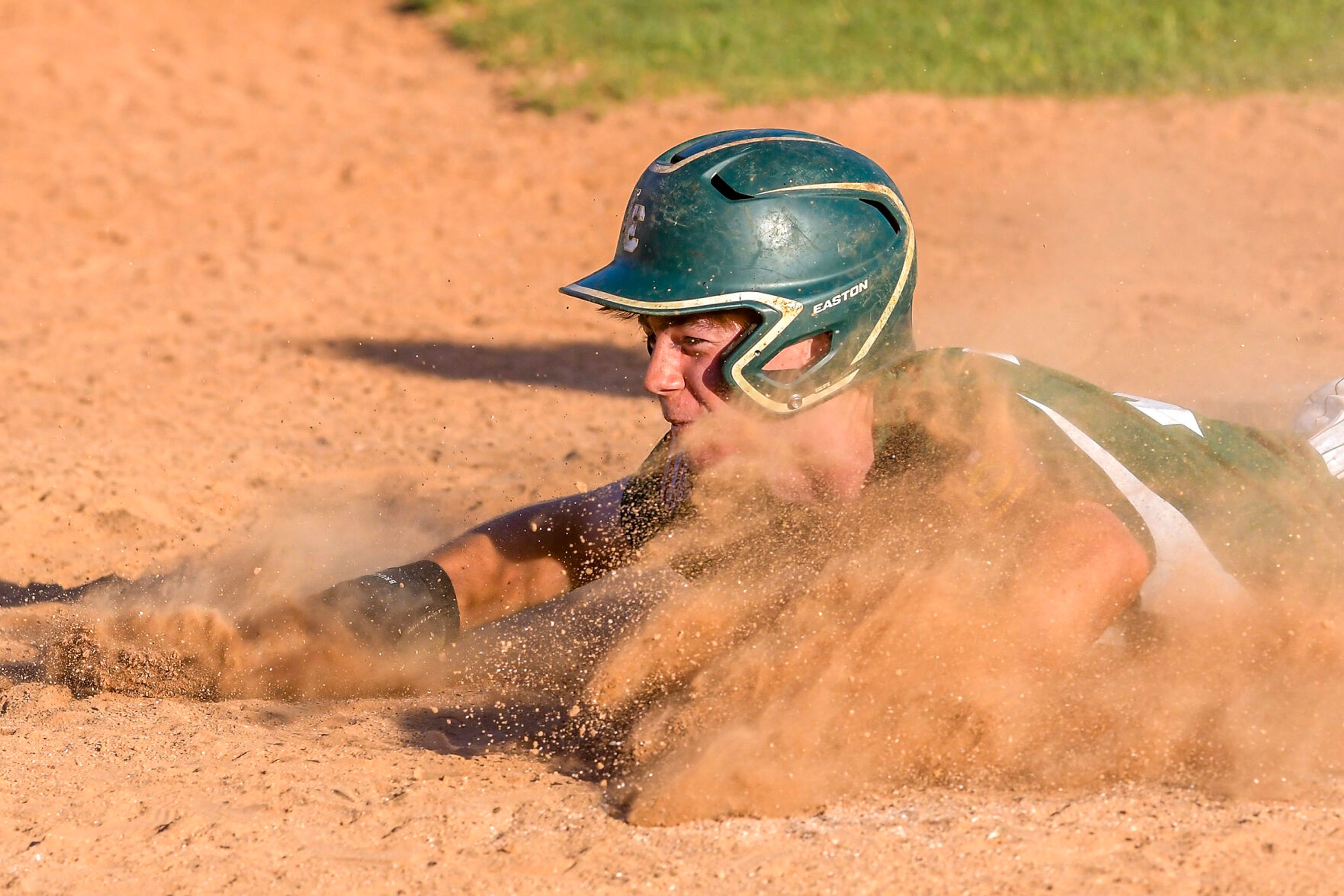 The Lewis-Clark Cubs' Cody Blackwell slides into home to score against Moscow in a game of the Clancy Ellis Tournament on Saturday at Harris Field in Lewiston.