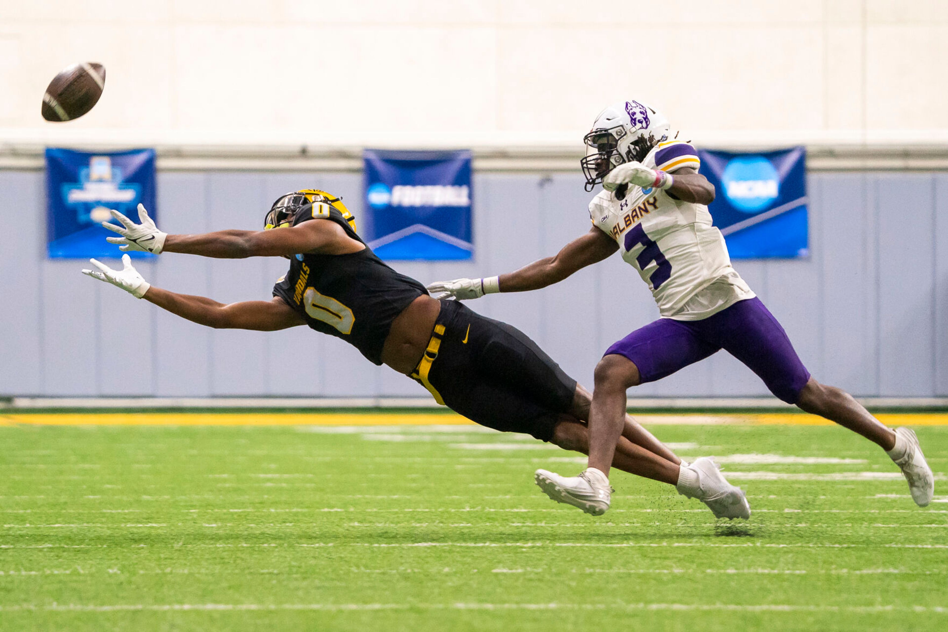 Idaho Vandals wide receiver Terez Traynor (0) dives as he attempts to catch the ball during their game against Albany in the third round of the 2023 Division I FCS Football Championship on Saturday inside the Kibbie Dome in Moscow.