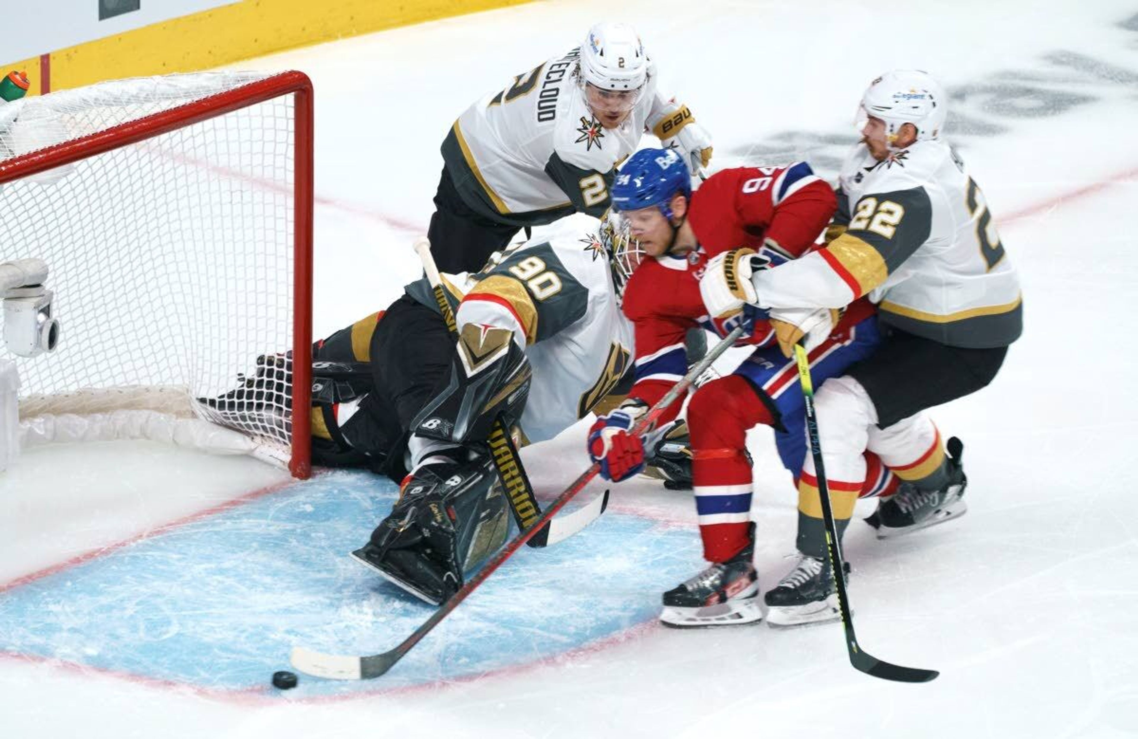 Montreal Canadiens' Corey Perry can't get the puck past a net left empty by Vegas Golden Knights goaltender Robin Lehner as he is held back by defenseman Nick Holden during the first period of Game 4 in an NHL Stanley Cup playoff hockey semifinal in Montreal, Sunday, June 20, 2021.