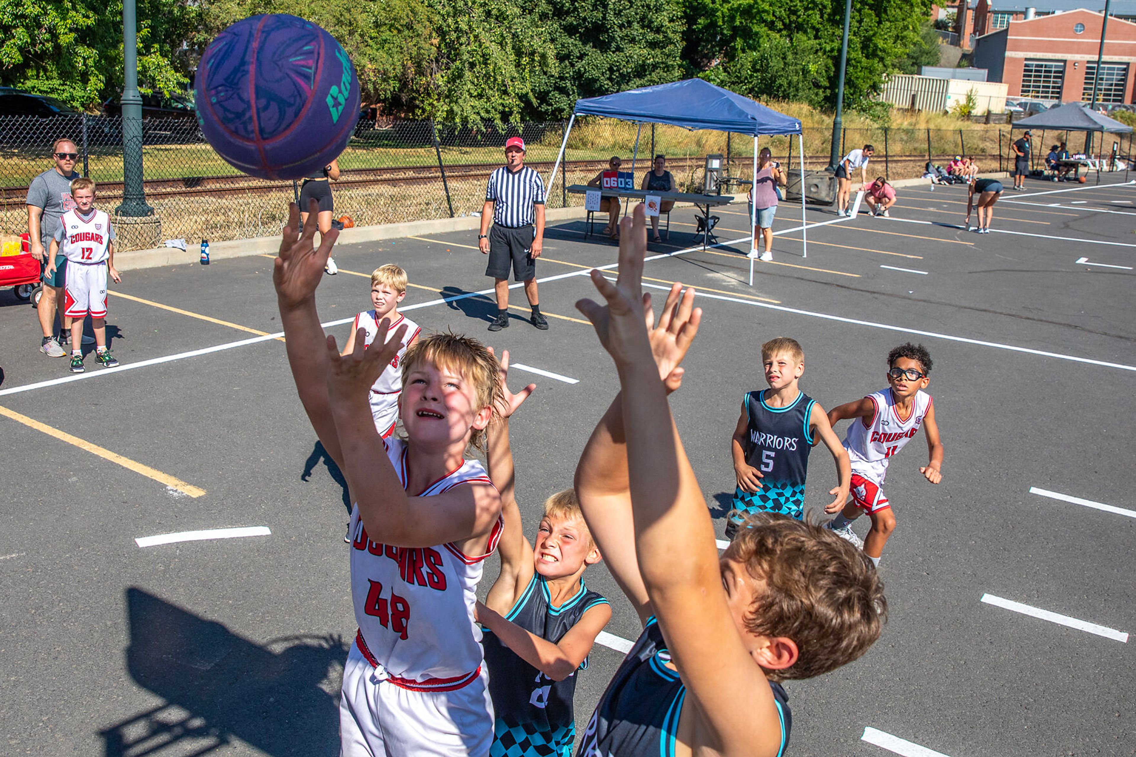 Kids play basketball Saturday at Lentil fest in Reaney Park in Pullman.