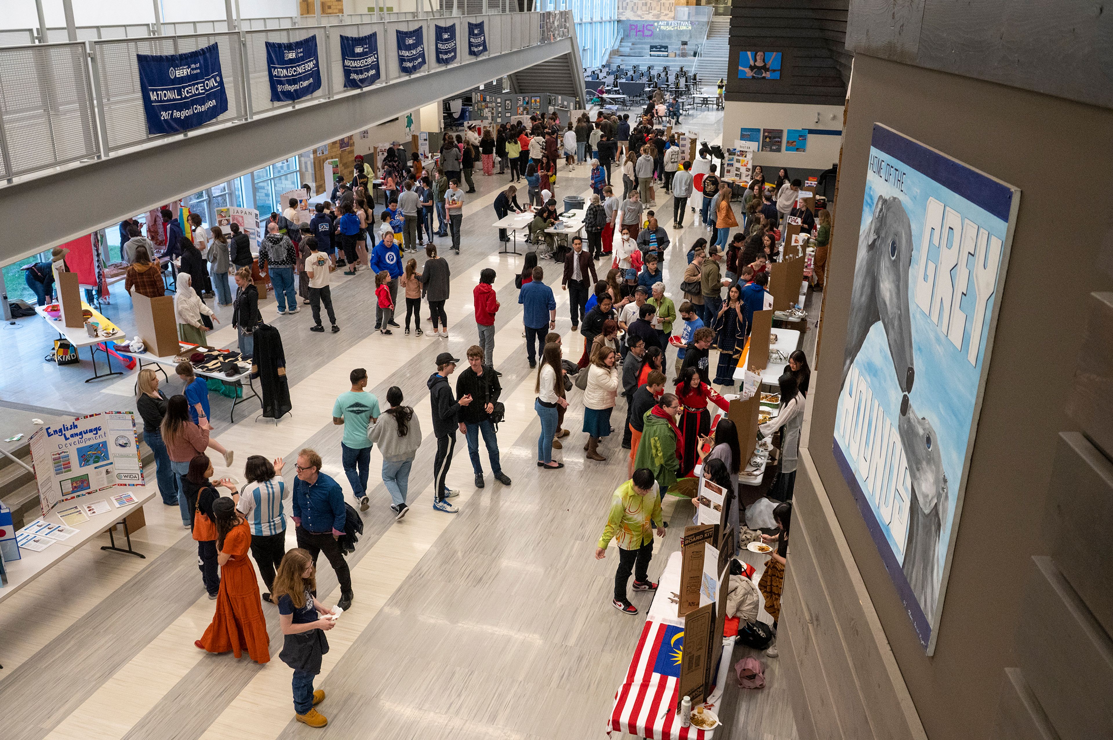 People wander to stands that offer food and information about various nations Friday at Pullman High School’s multicultural night.