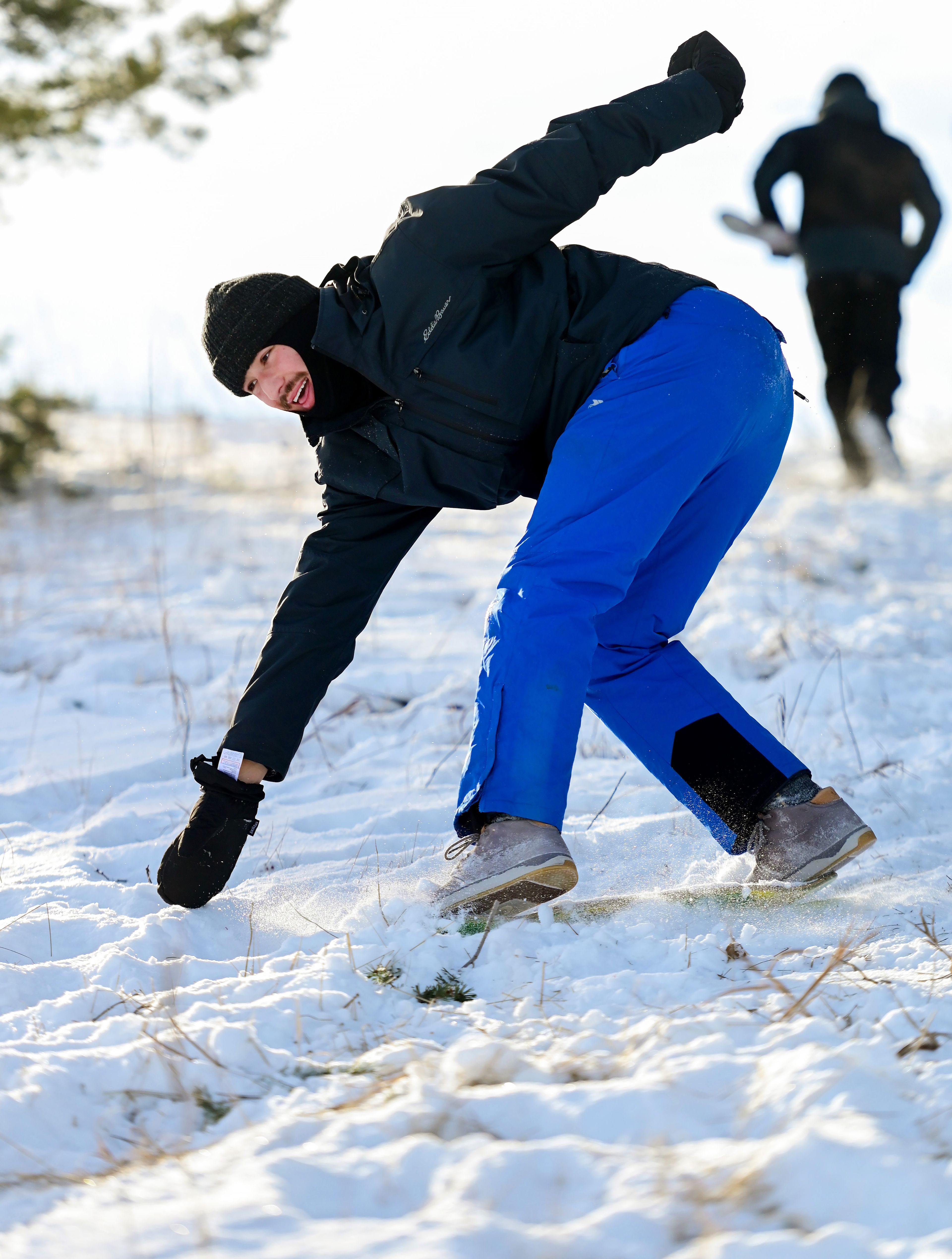 University of Idaho student Trevor Jones leans over to regain balance while sliding down an incline using a wheel-less skateboard on Monday in Moscow.