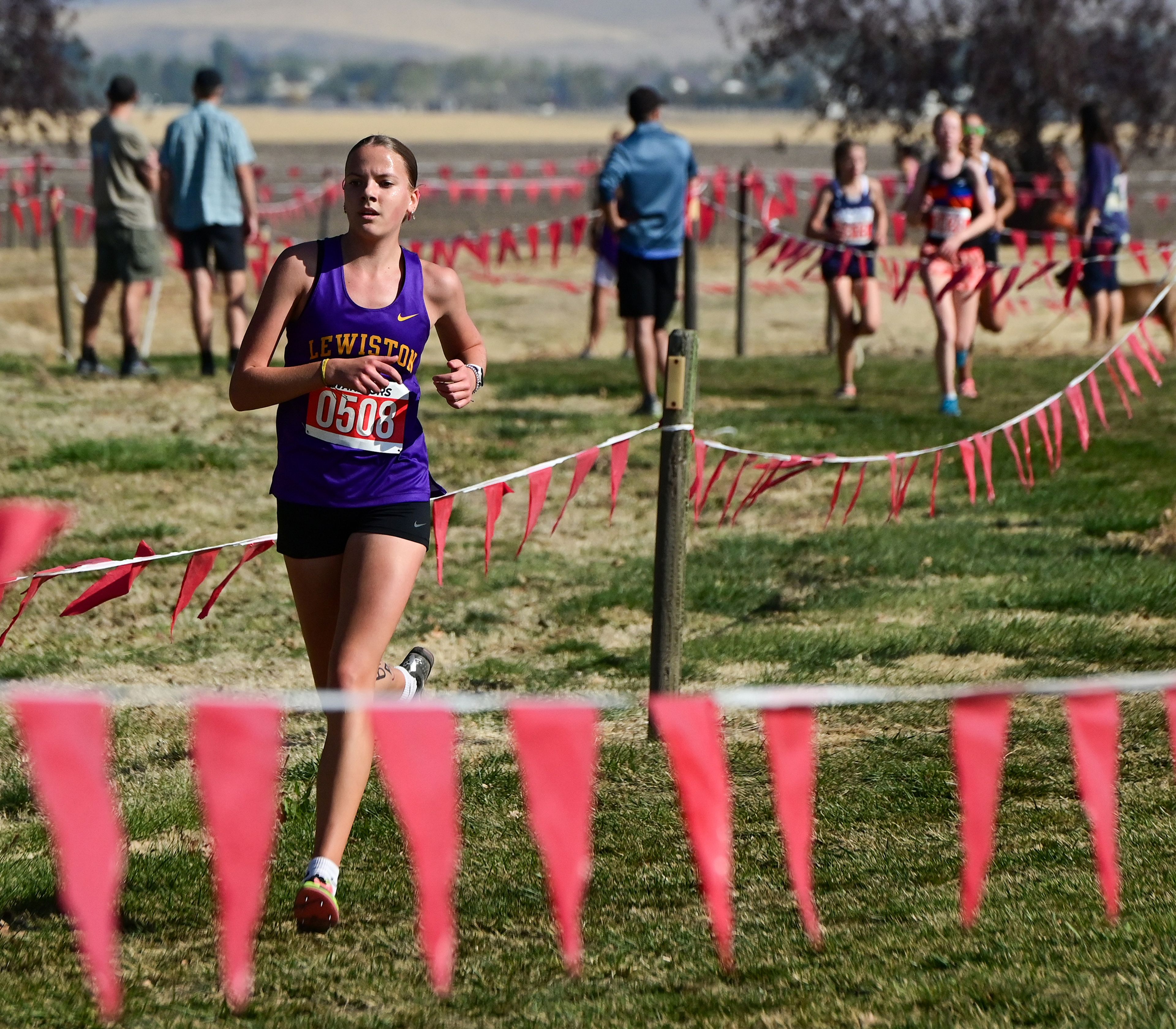 Lewiston's Addisyn Storm competes in the Inland Empire Championships varsity girls 5K Saturday along the LCSC XC Course in Lewiston.,