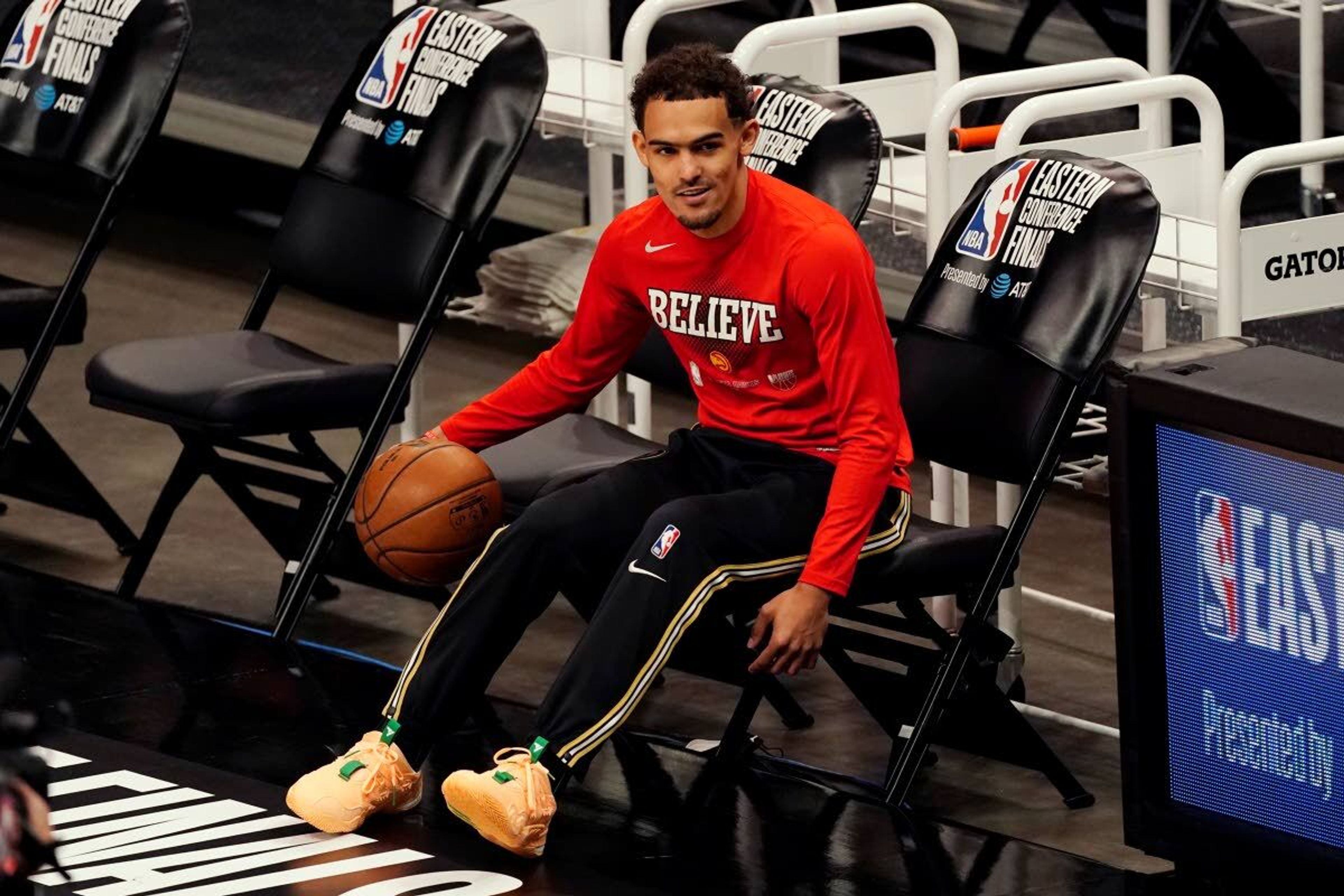 Atlanta Hawks guard Trae Young warms up before Game 6 of the team's NBA basketball playoffs Eastern Conference finals against the Milwaukee Bucks, Saturday, July 3, 2021, in Atlanta. (AP Photo/John Bazemore)