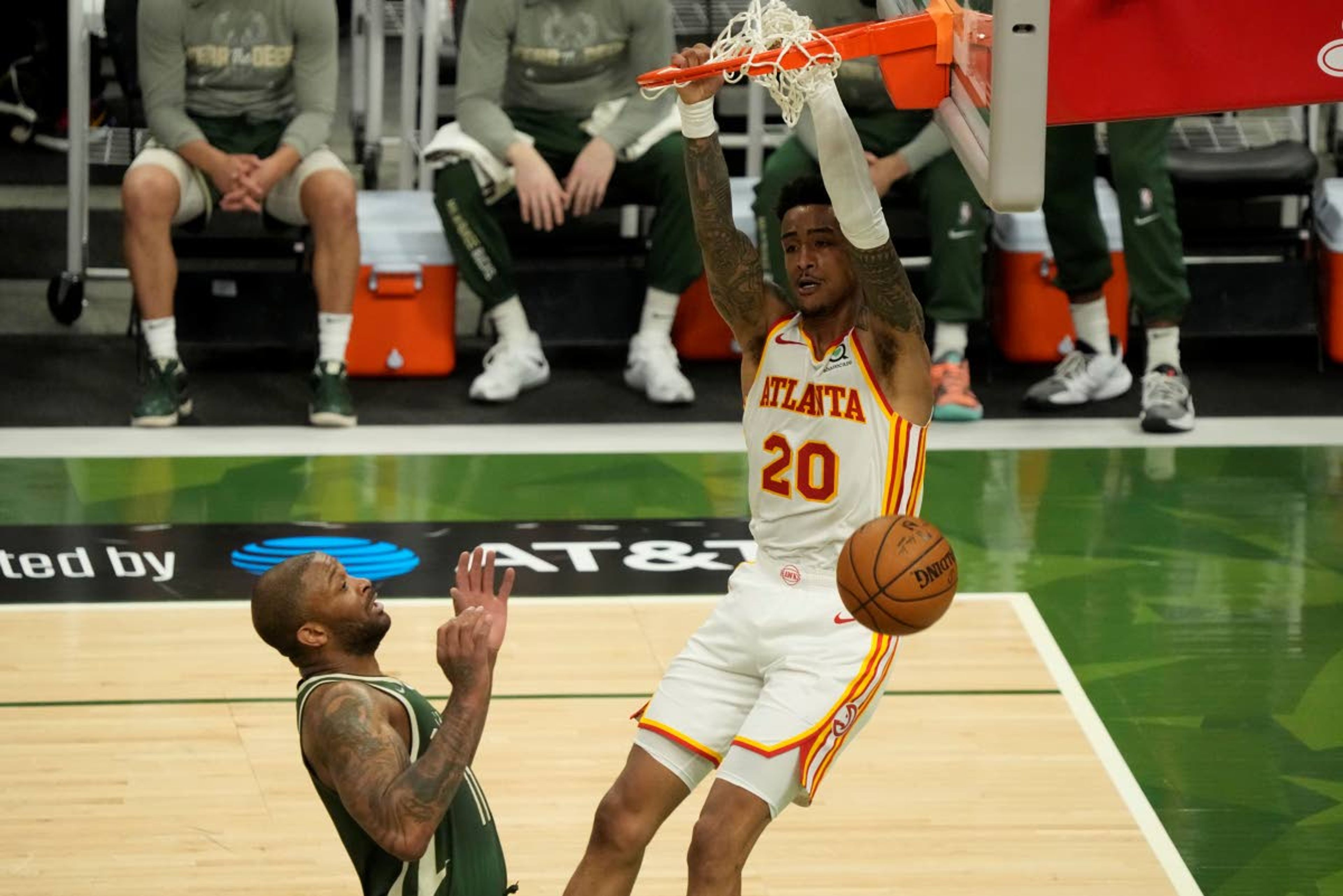 Atlanta Hawks' John Collins dunks during the second half of Game 1 of the NBA Eastern Conference basketball finals game against the Milwaukee Bucks Wednesday, June 23, 2021, in Milwaukee. (AP Photo/Morry Gash)