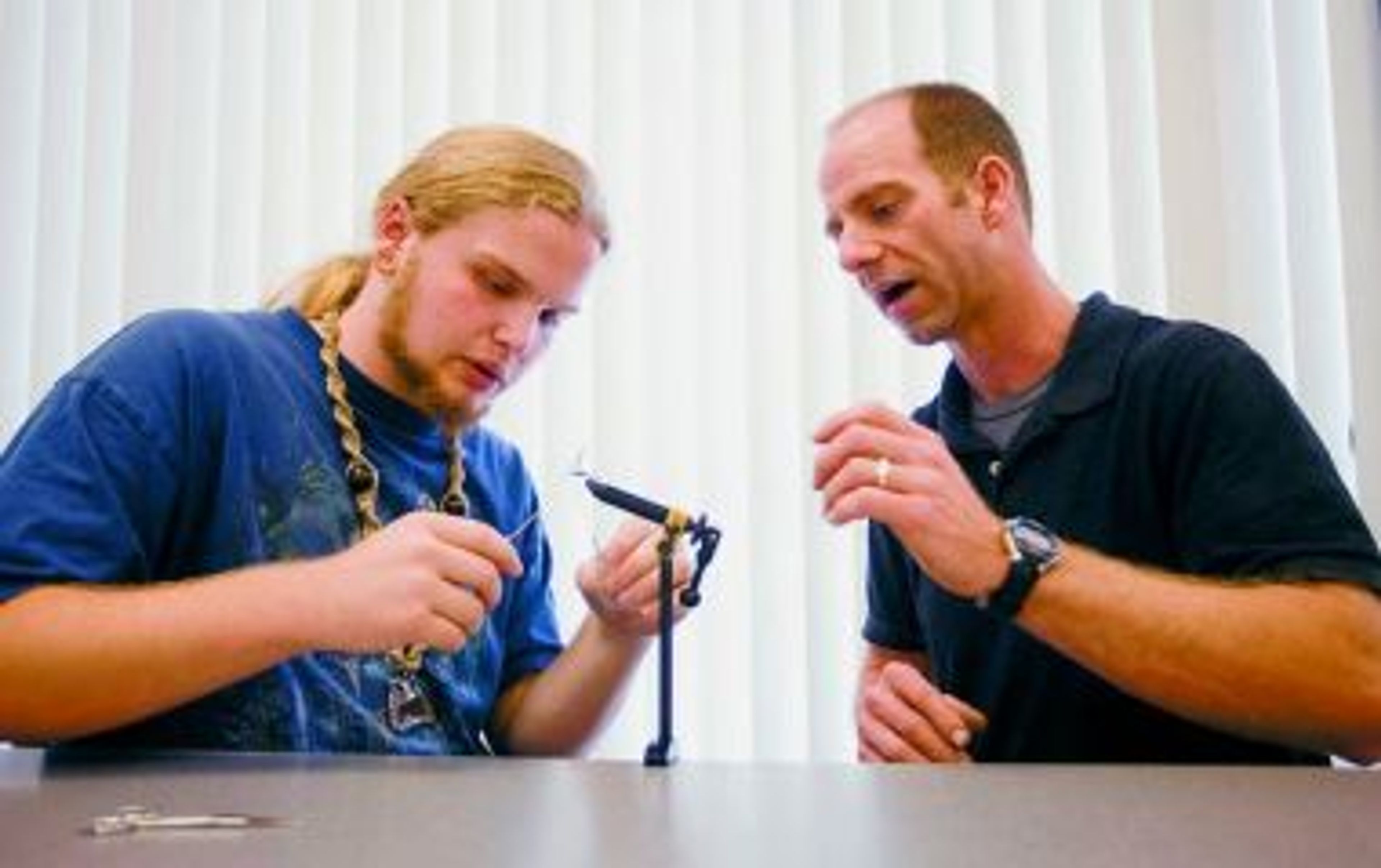 Students finish ecology class by learning to tie flies