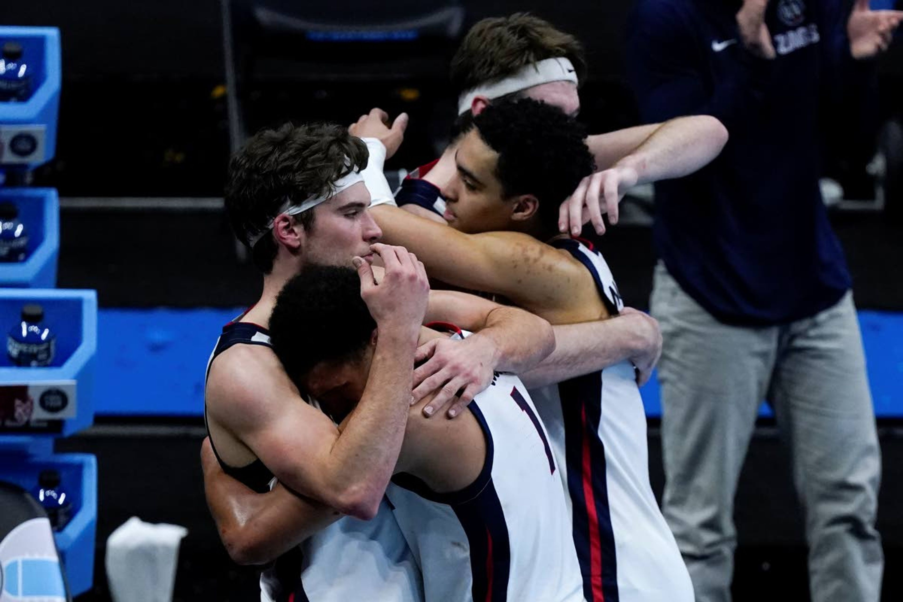 Gonzaga guard Jalen Suggs (1) gets a hug from teammate forward Corey Kispert, left, at the end of the championship game against Baylor in the men's Final Four NCAA college basketball tournament, Monday, April 5, 2021, at Lucas Oil Stadium in Indianapolis. Baylor won 86-70. (AP Photo/Michael Conroy)