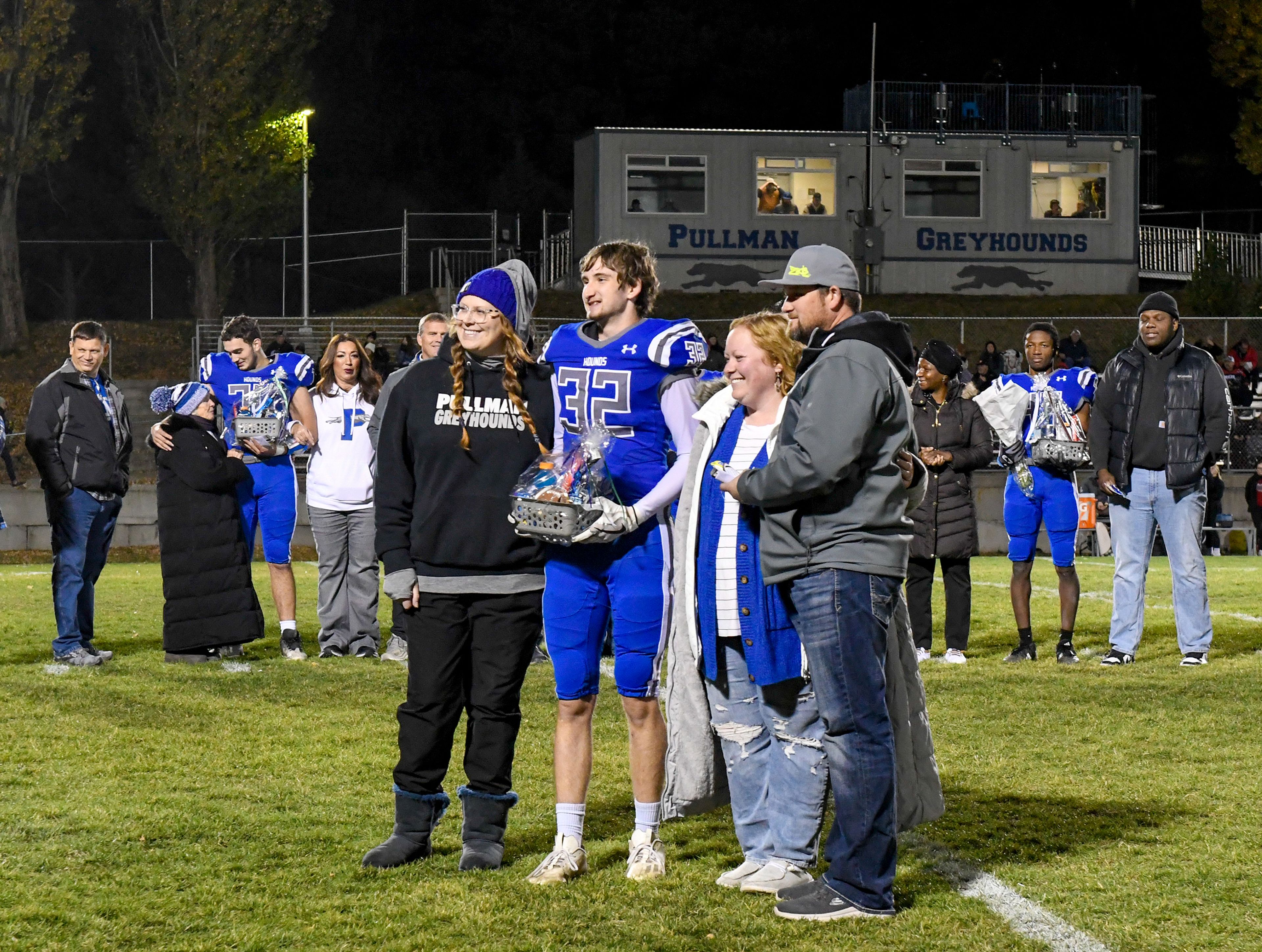 Pullman seniors are recognized on the field with their loved ones Friday before a game against Clarkston in Pullman.,