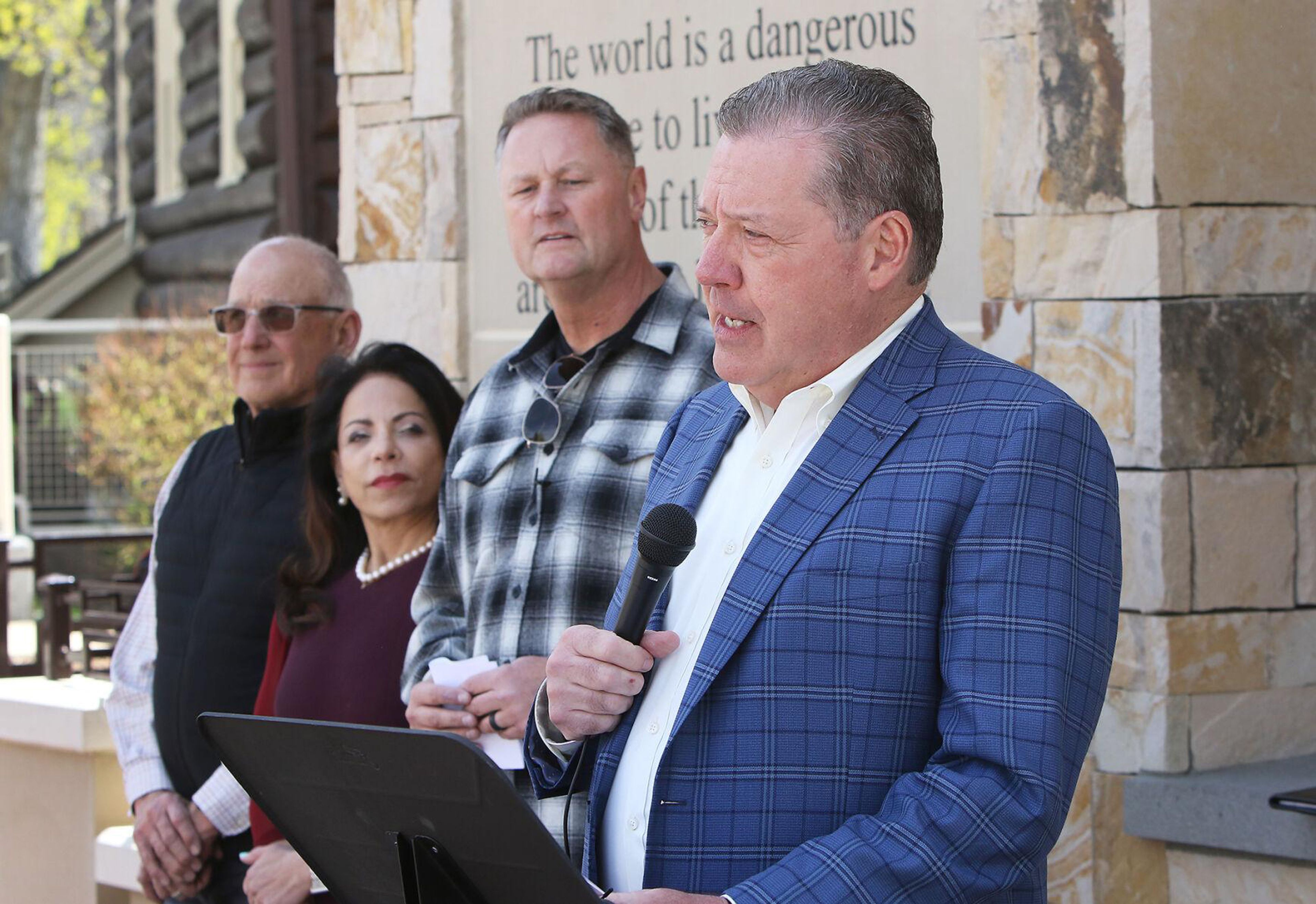 Retired Ada County Sheriff Gary Raney, right, is joined by Gross Farms CEO Doug Gross, far left, Saint Alphonsus President and CEO Odette Bolano, and BVA Development CEO Tommy Ahlquist during a news conference denouncing extremism in Idaho.