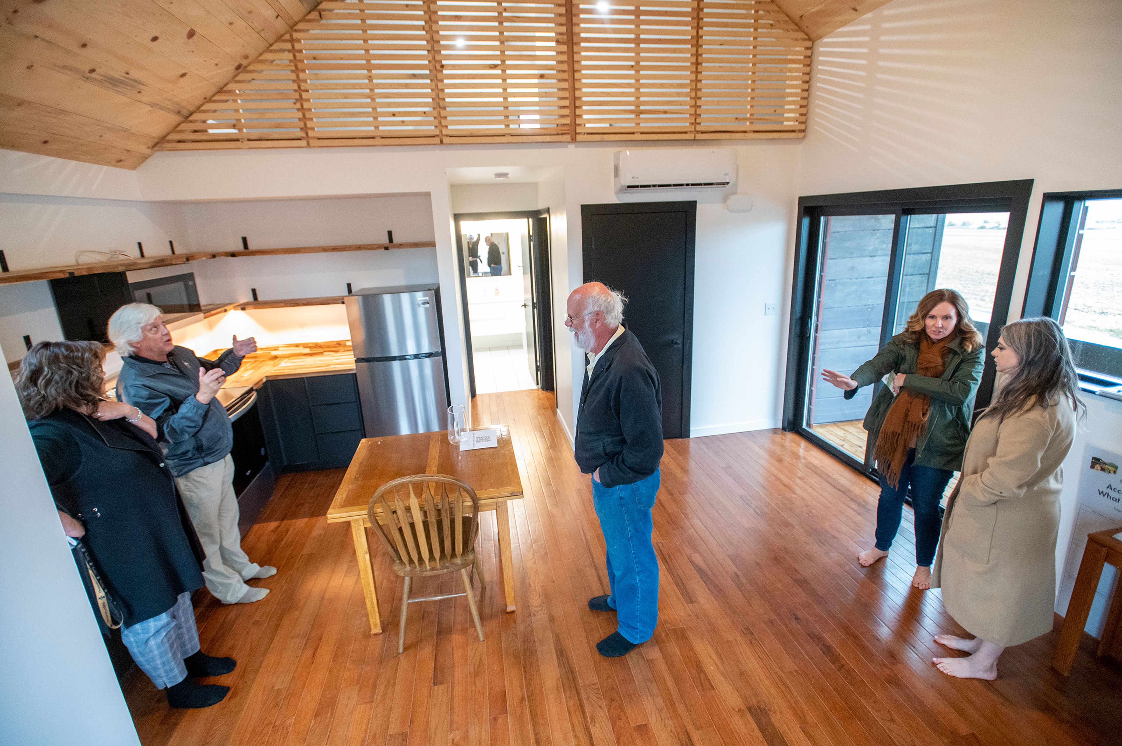 Guests tour a newly built home by members of Moscow Affordable Housing Trust and the University of Idaho in Moscow on Friday.