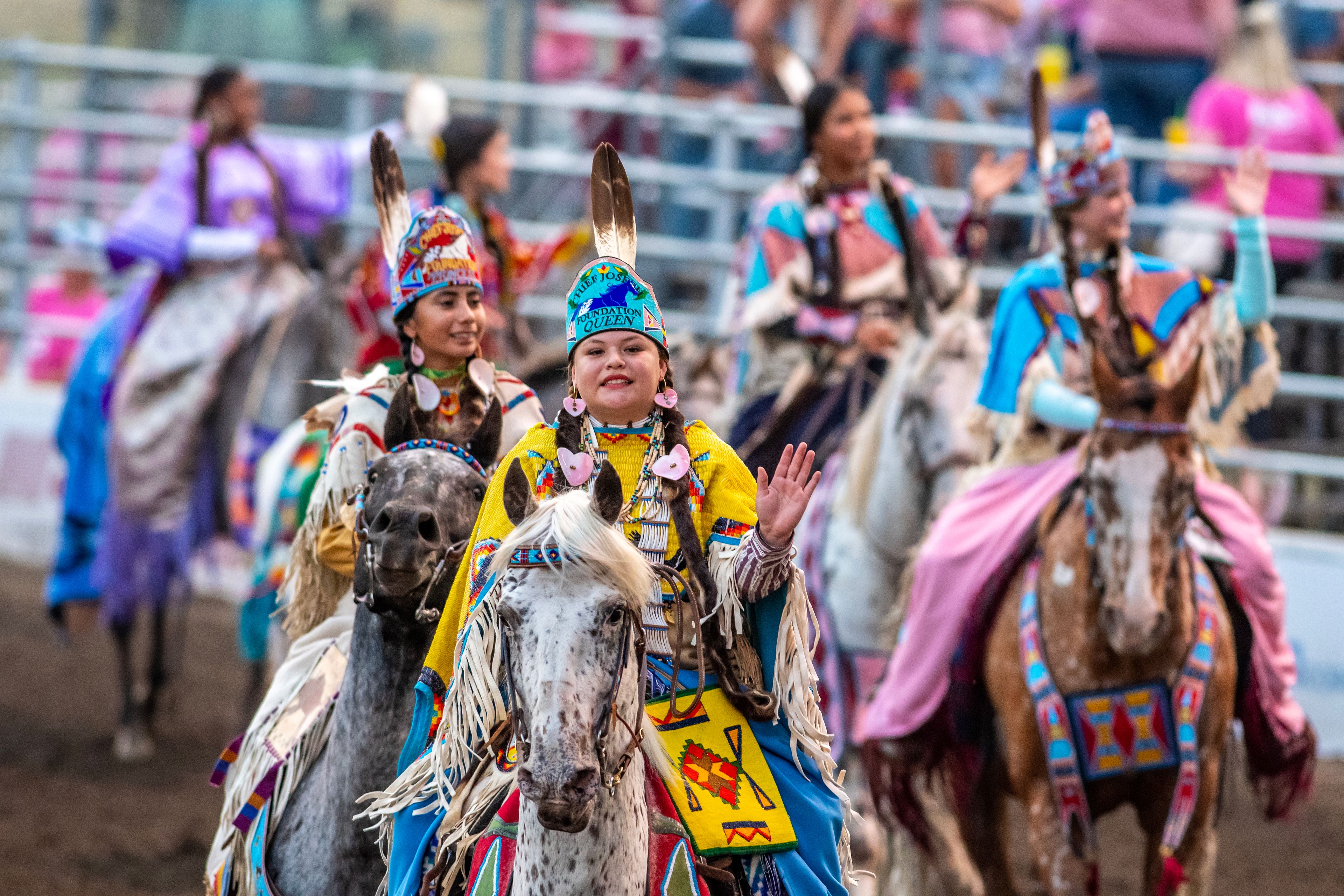 Members of the Nez Perce Tribe ride around the arena on day 3 of the Lewiston Roundup.