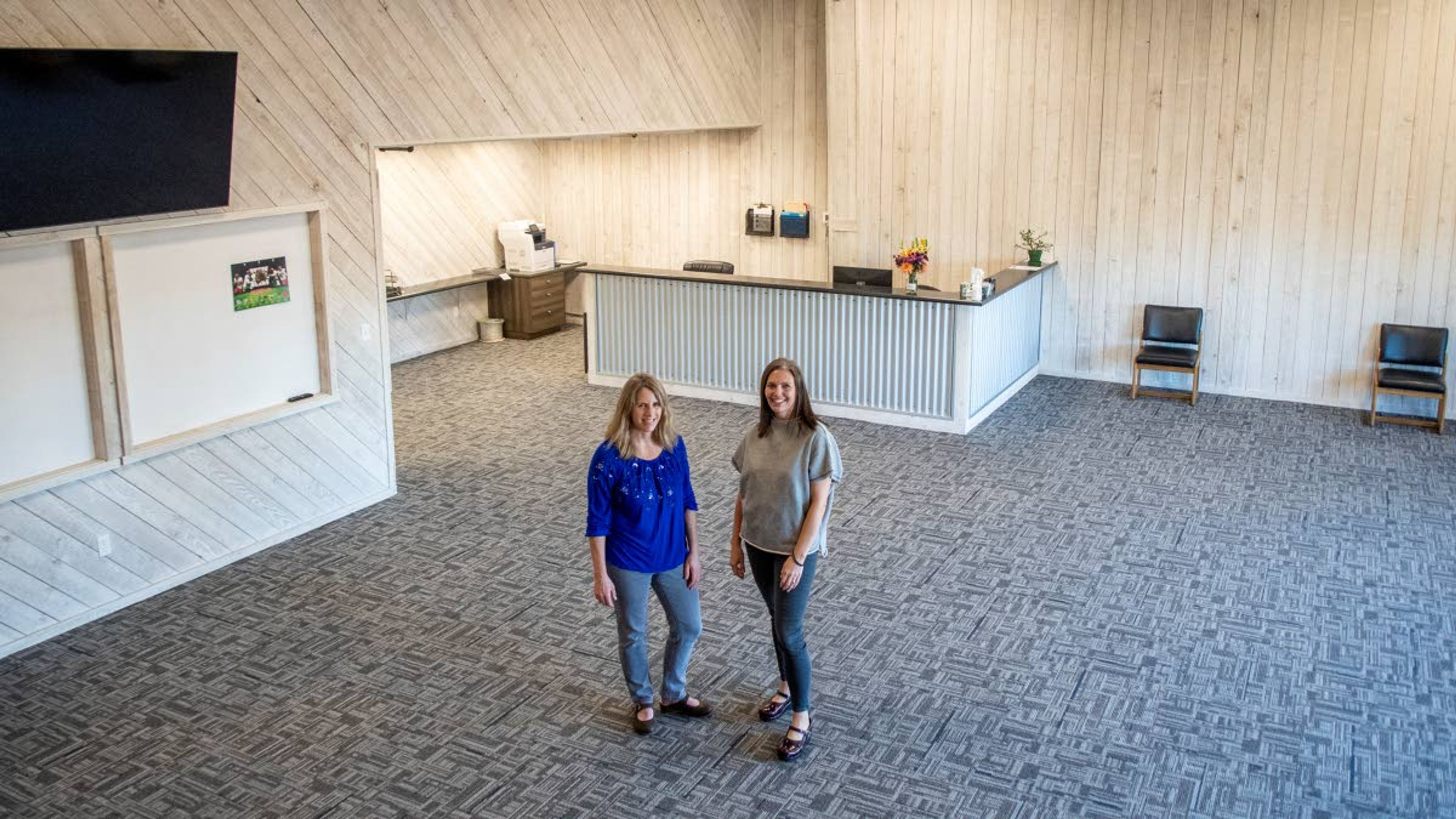 Owners Brenda Boyko, left, and Kelly Isakson stand in the lobby of Reactiv Training Center in Moscow as they pose for a portrait on Thursday afternoon. Boyko and Isakson said that it’s important for their clients to not only have a space for working out, but also room to complete schoolwork or watch game film.