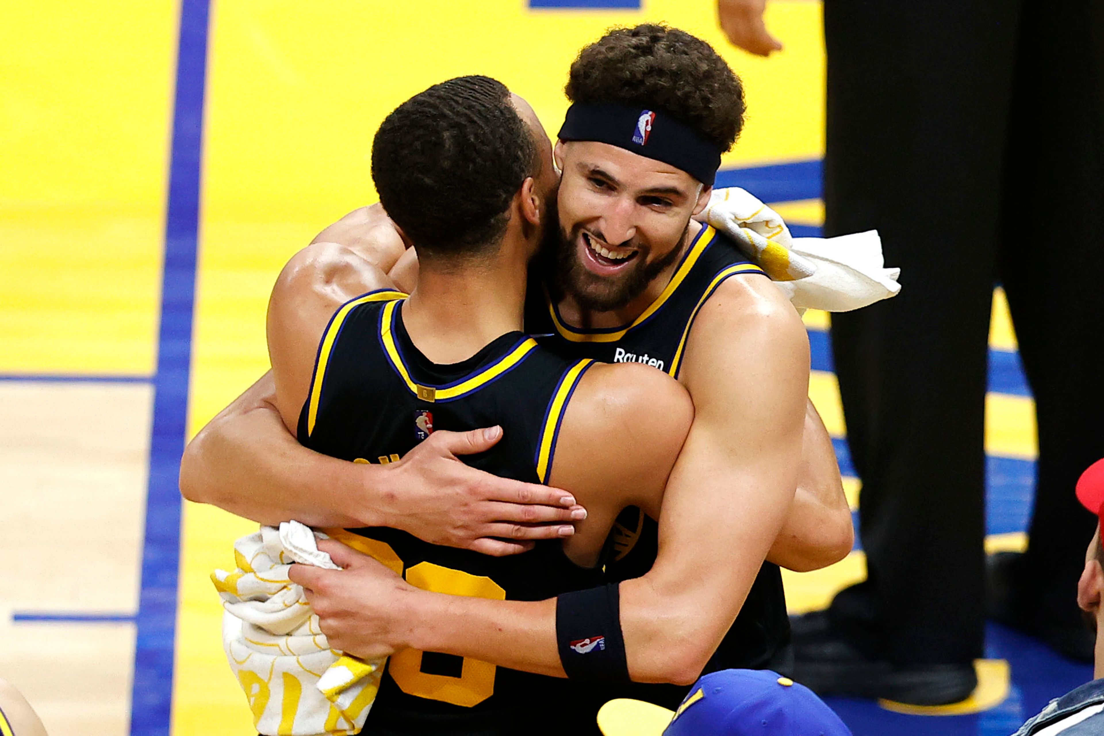 Associated PressKlay Thompson, right, hugs Stephen Curry after the Warriors beat the Mavericks for the NBA Western Conference title Thursday in San Francisco.