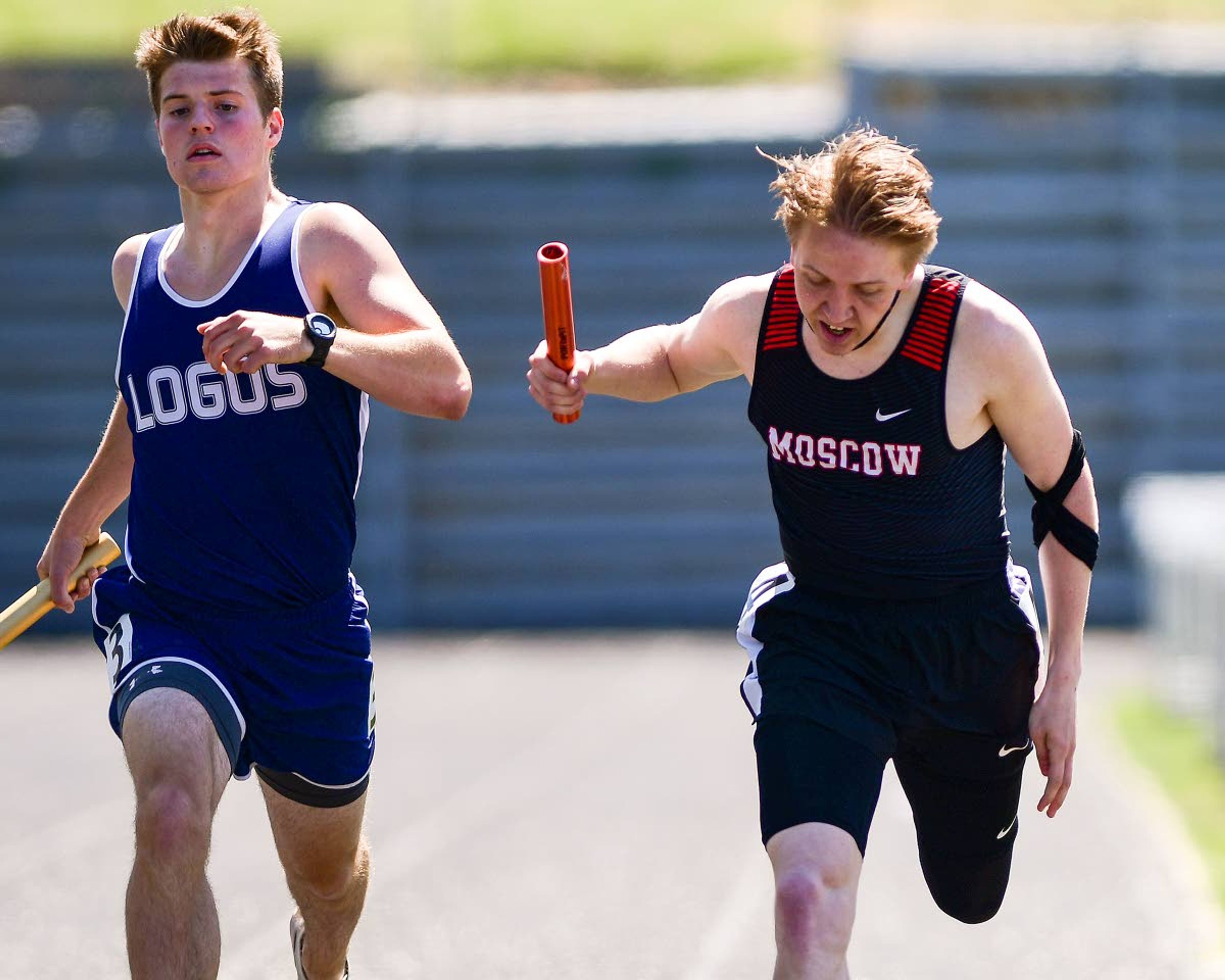 Moscow’s Jaxson Blaker holds on to beat a surging Alex Blum, from Logos, in the Sprint Medley Relay on Thursday at the District II Meet of Champions at Vollmer Bowl in Lewiston. The Moscow relay squad won the race by less than a tenth of a second.