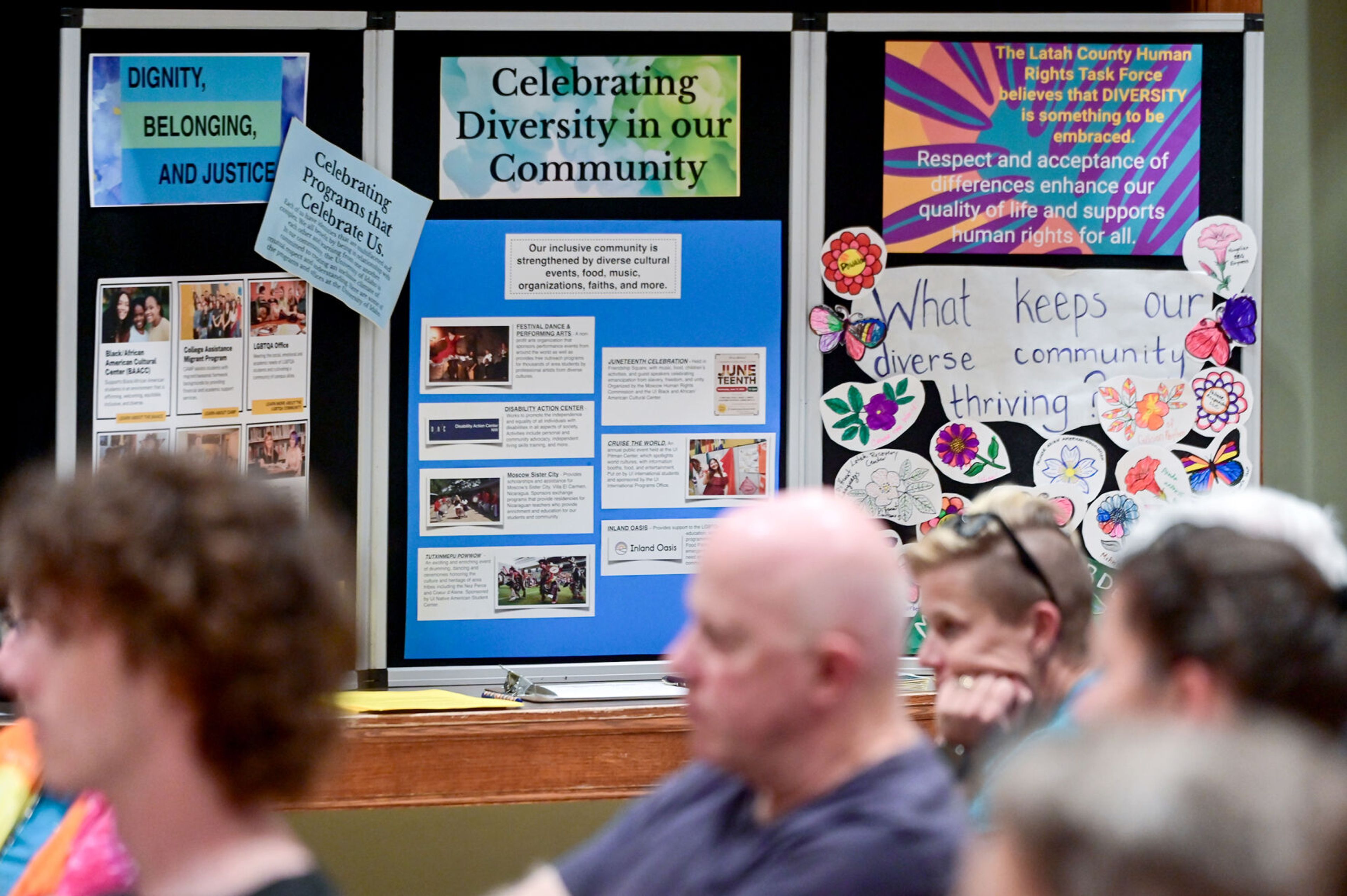 Posters from the Latah County Human Rights Task Force sharing local events and other information sit along a wall of the 1912 Center during a United Against Hate summit Monday in Moscow.