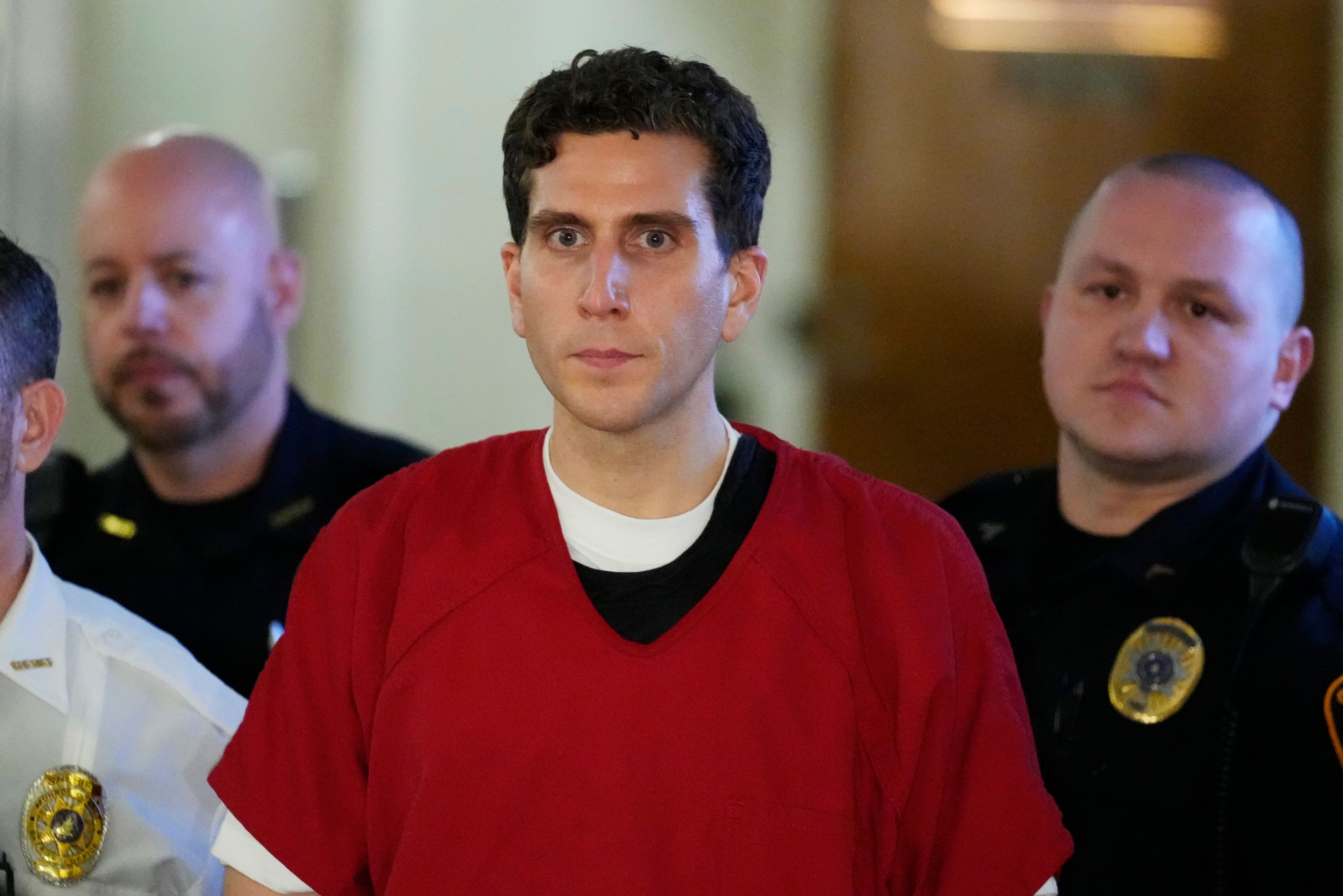 Bryan Kohberger, who is accused of killing four University of Idaho students, is escorted to an extradition hearing at the Monroe County Courthouse in Stroudsburg, Pa., on Tuesday.