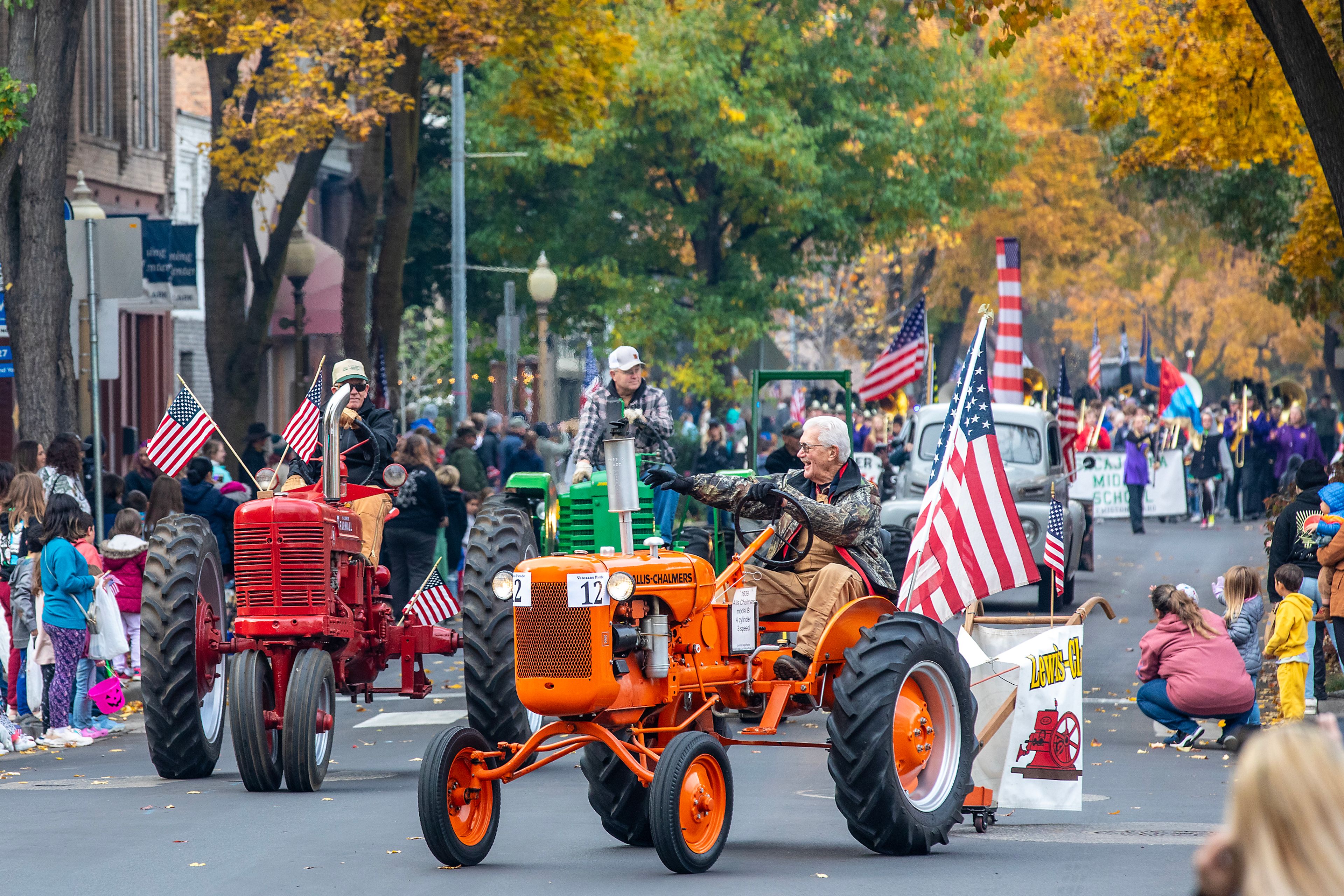 People drive tractors Saturday at the Veteran’s Day Parade on Main Street in Lewiston.