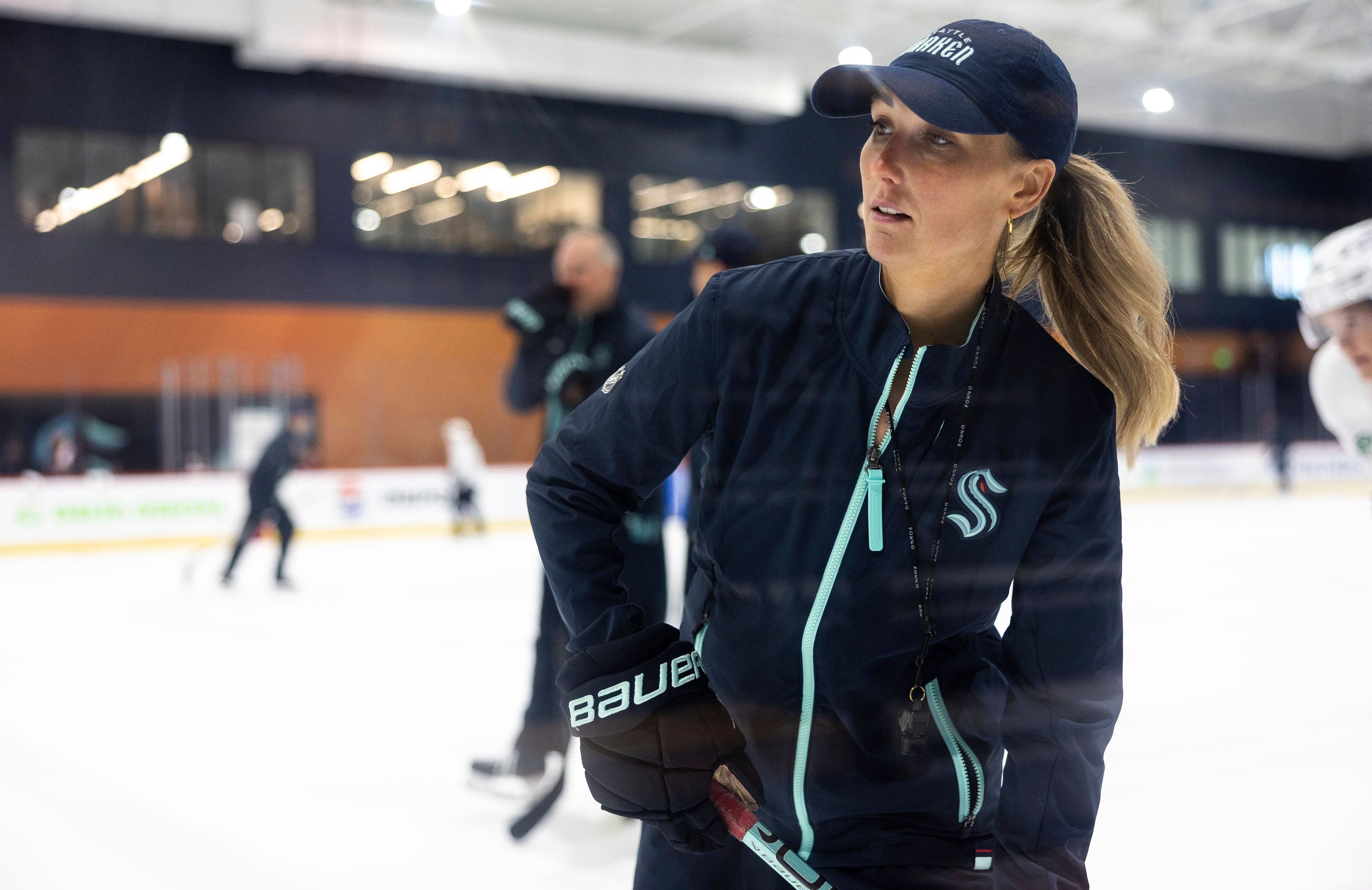 Jessica Campbell runs a drill during a Seattle Kraken rookie development camp on Tuesday, July 2, 2024, in Seattle. Campbell will become the first woman to work on the bench of an NHL franchise after the Seattle Kraken hired her as an assistant coach Wednesday, July 3, 2024. (Nick Wagner/The Seattle Times via AP)