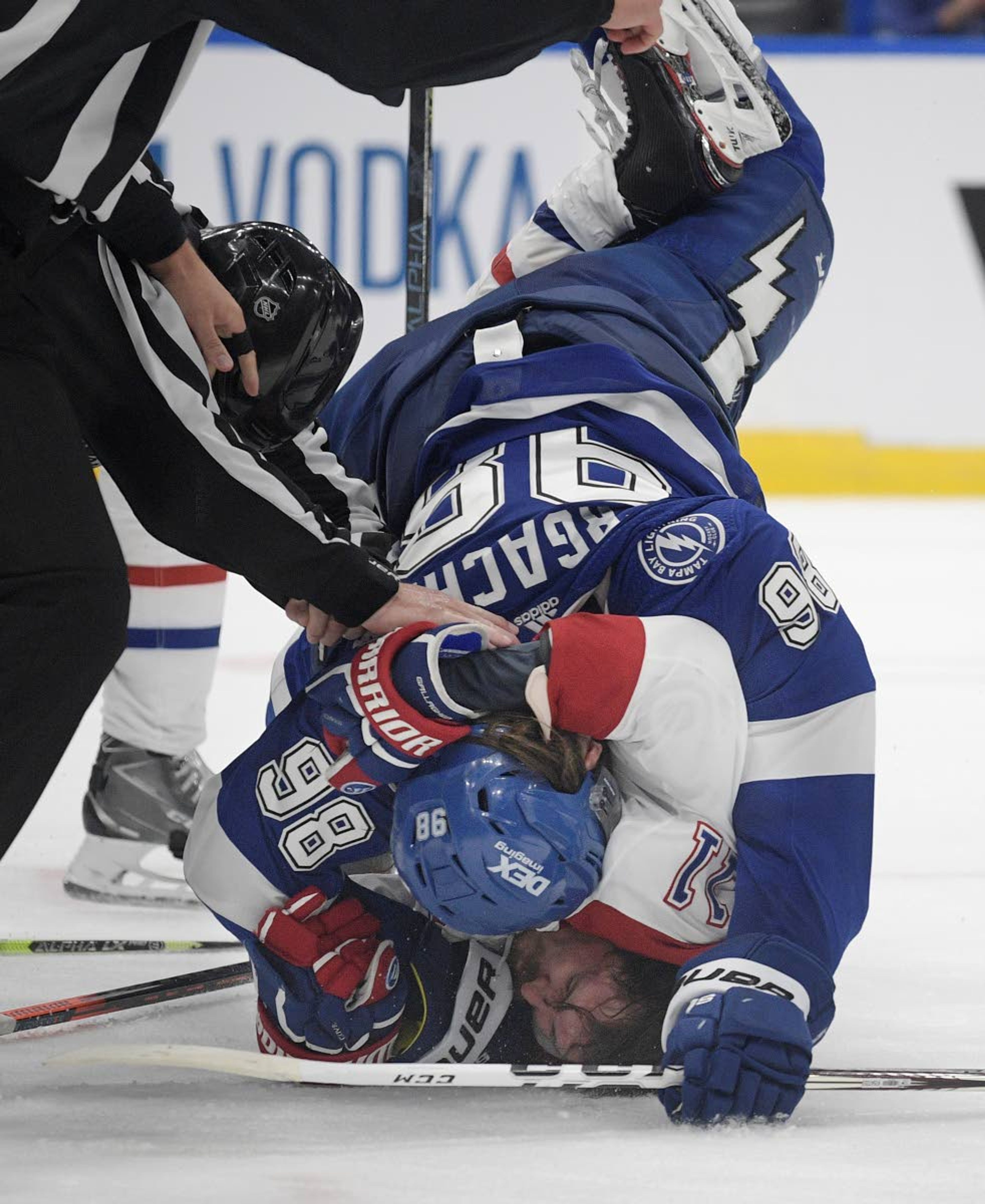 Tampa Bay Lightning defenseman Mikhail Sergachev checks Montreal Canadiens right wing Brendan Gallagher (11) on the ice during the third period in Game 1 of the NHL hockey Stanley Cup finals, Monday, June 28, 2021, in Tampa, Fla. (AP Photo/Phelan Ebenhack)