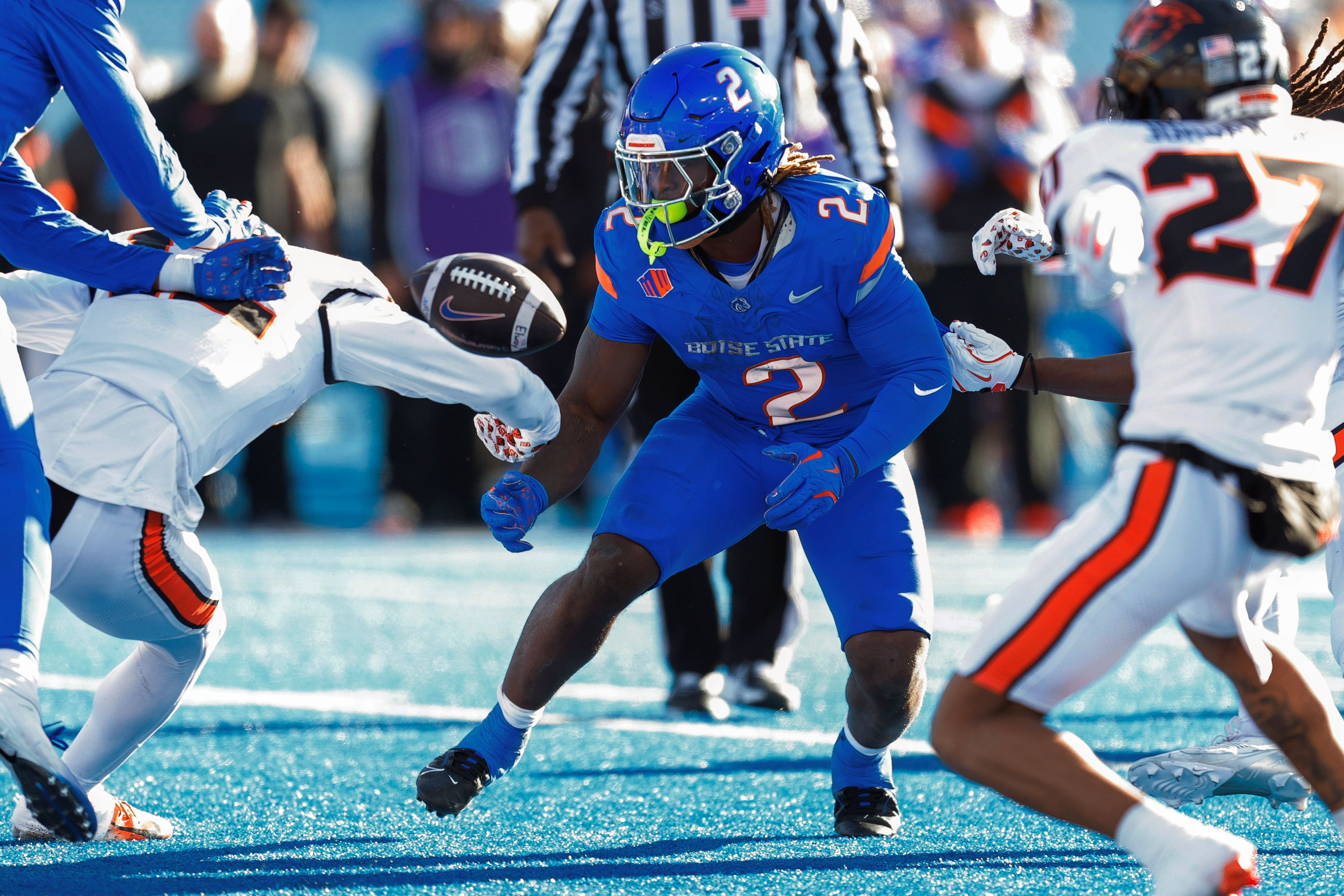 Boise State running back Ashton Jeanty (2) fumbles the ball late in the in the first half against Oregon State in an NCAA college football game, Friday, Nov. 29, 2024, in Boise, Idaho. (AP Photo/Steve Conner)