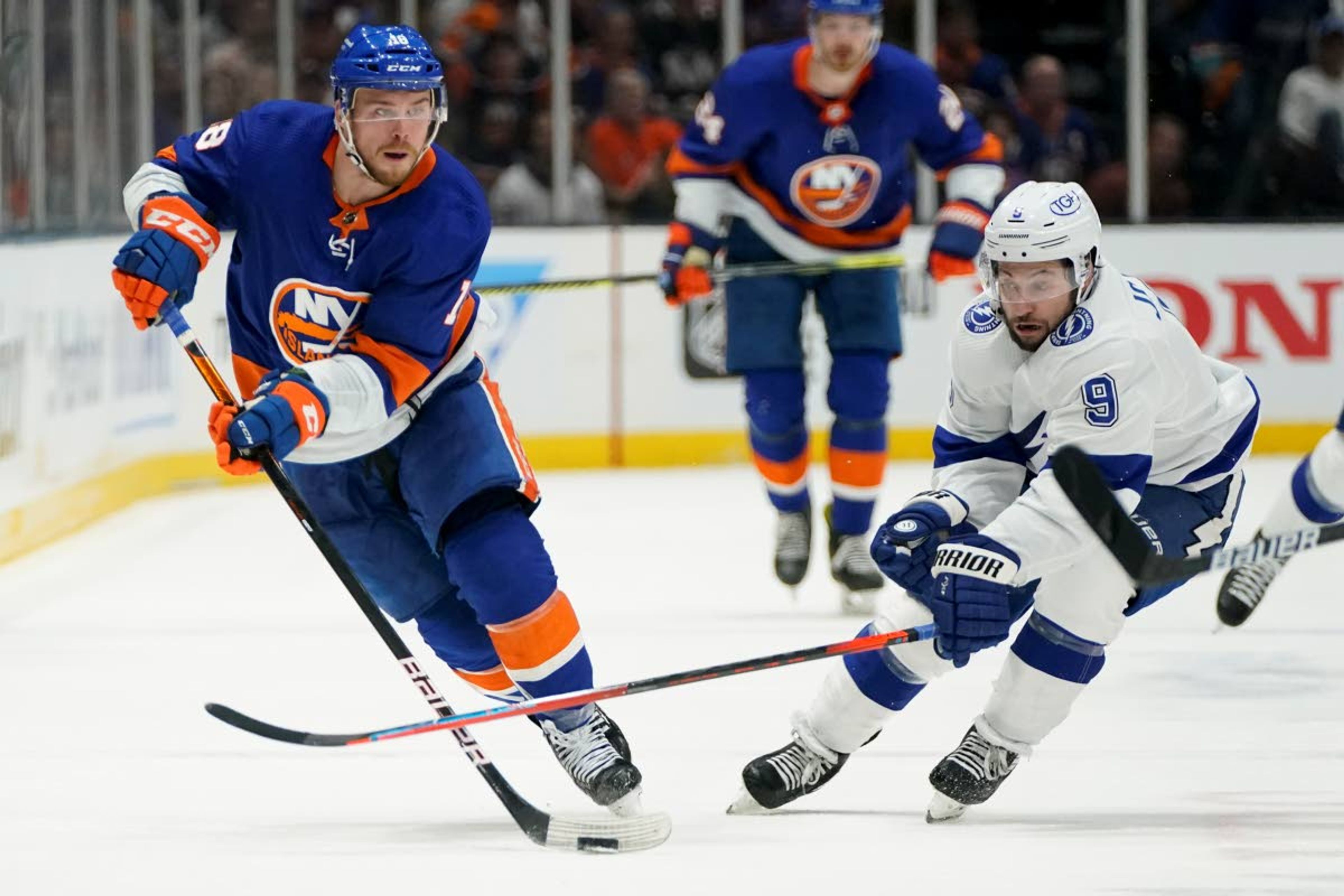 New York Islanders left wing Anthony Beauvillier (18) controls the puck against Tampa Bay Lightning center Tyler Johnson (9) during the second period of Game 6 of the NHL hockey Stanley Cup semifinals, Wednesday, June 23, 2021, in Uniondale, N.Y. (AP Photo/Frank Franklin II)