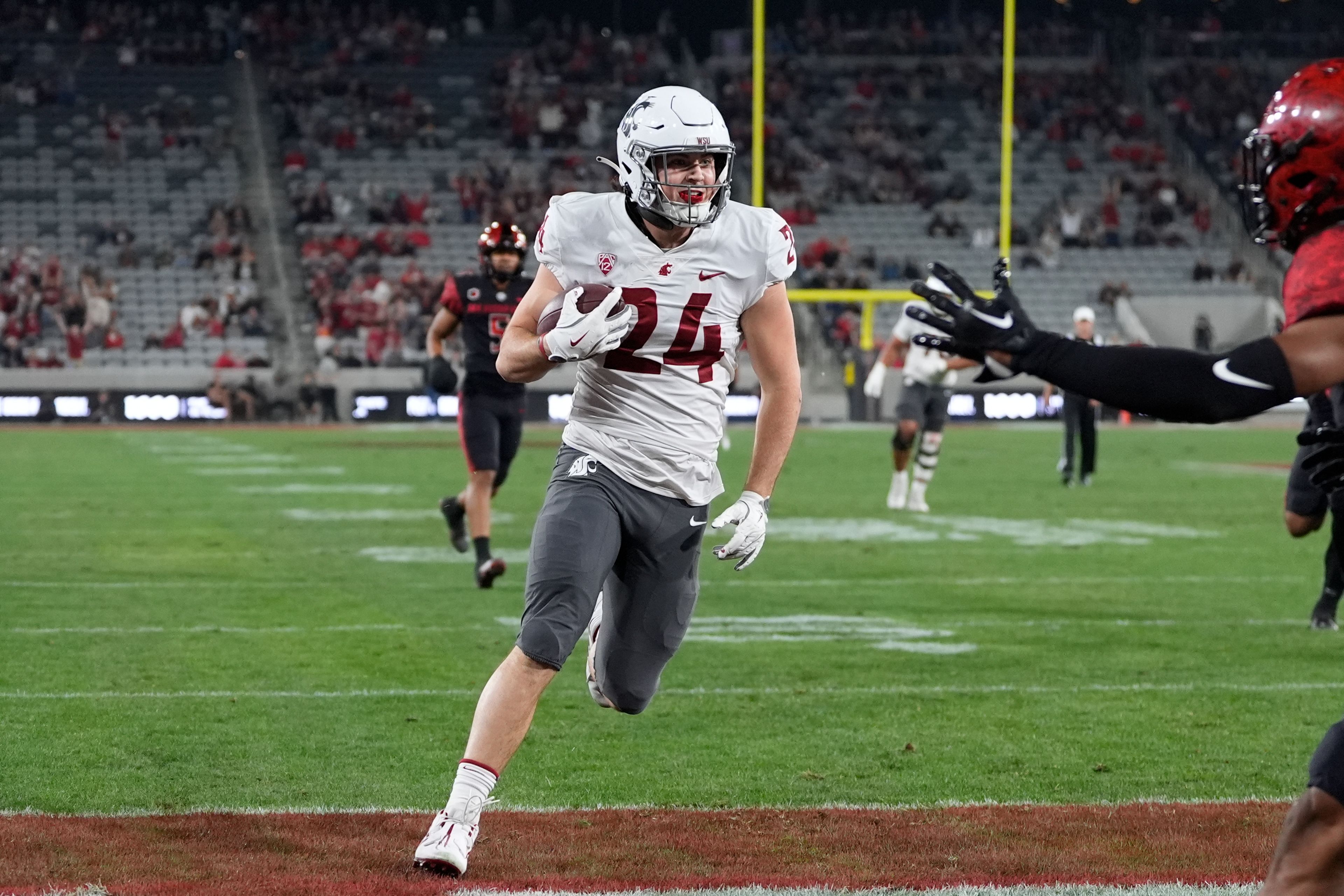 Washington State tight end Cooper Mathers scores a touchdown during the first half of an NCAA college football game against San Diego State Saturday, Oct. 26, 2024, in San Diego. (AP Photo/Gregory Bull)