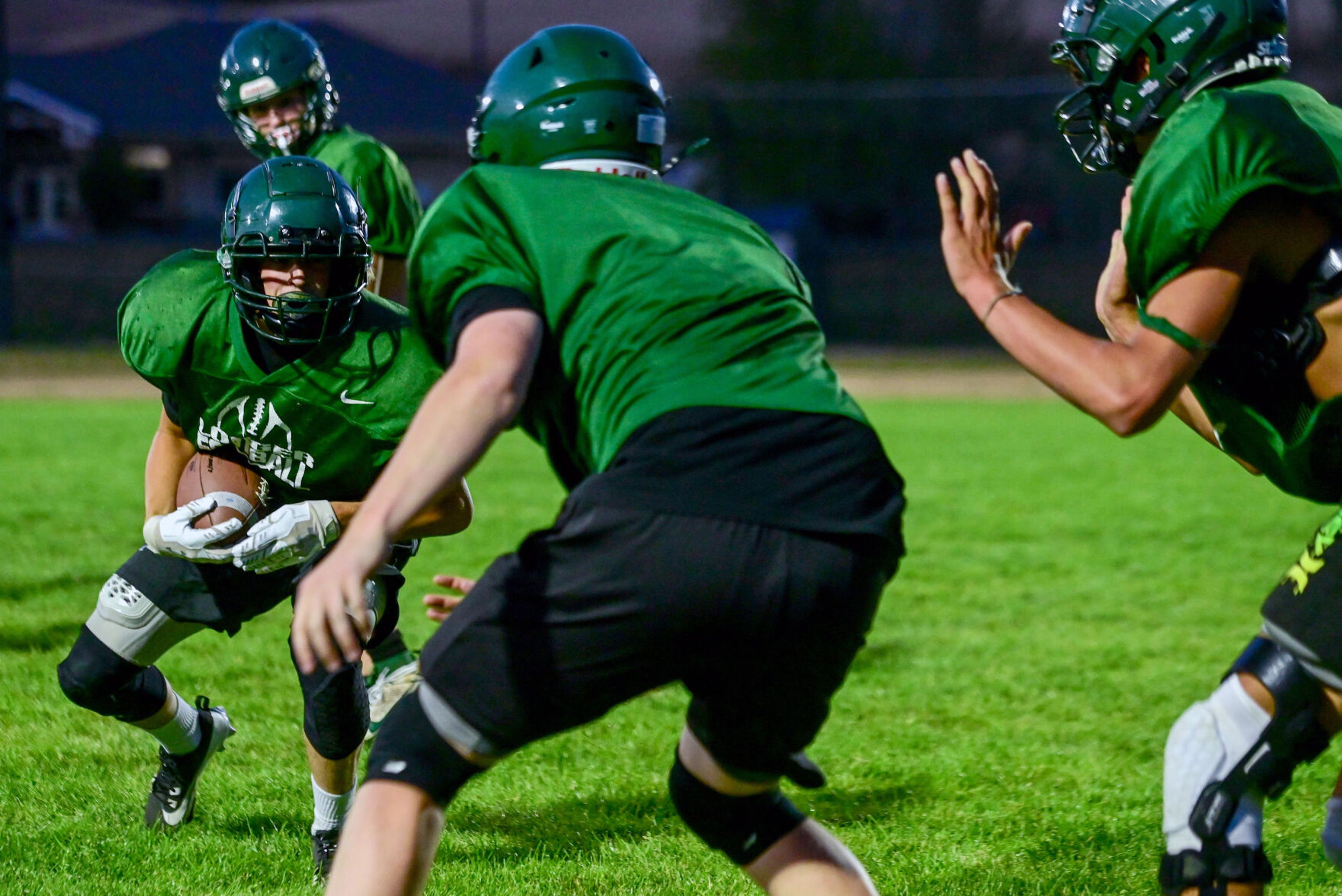 Potlatch players run through plays during practice on Tuesday.