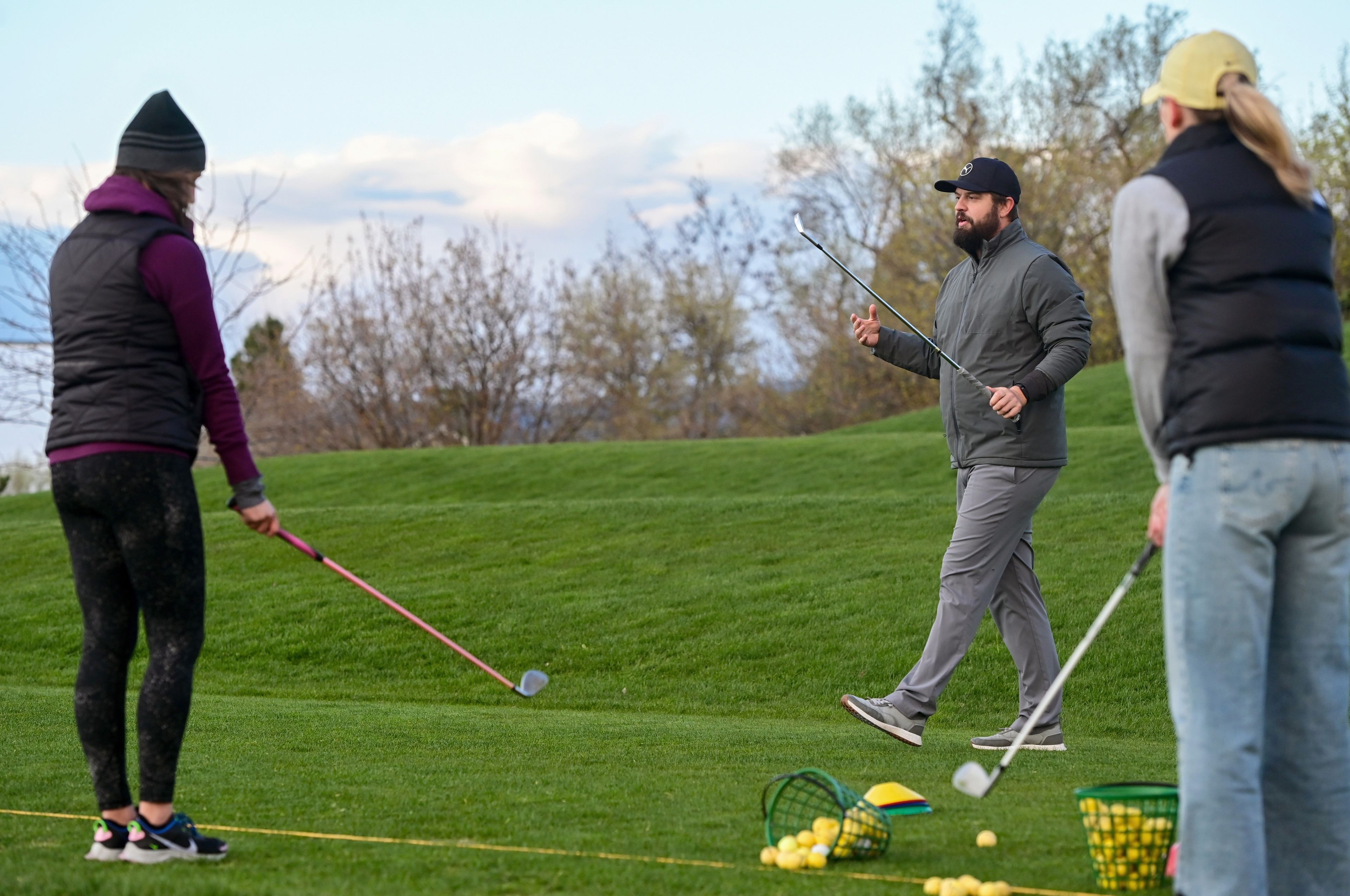 Michael Wagner, center, head golf professional at the University of Idaho Golf Course, instructs a women’s class in Moscow on Tuesday.