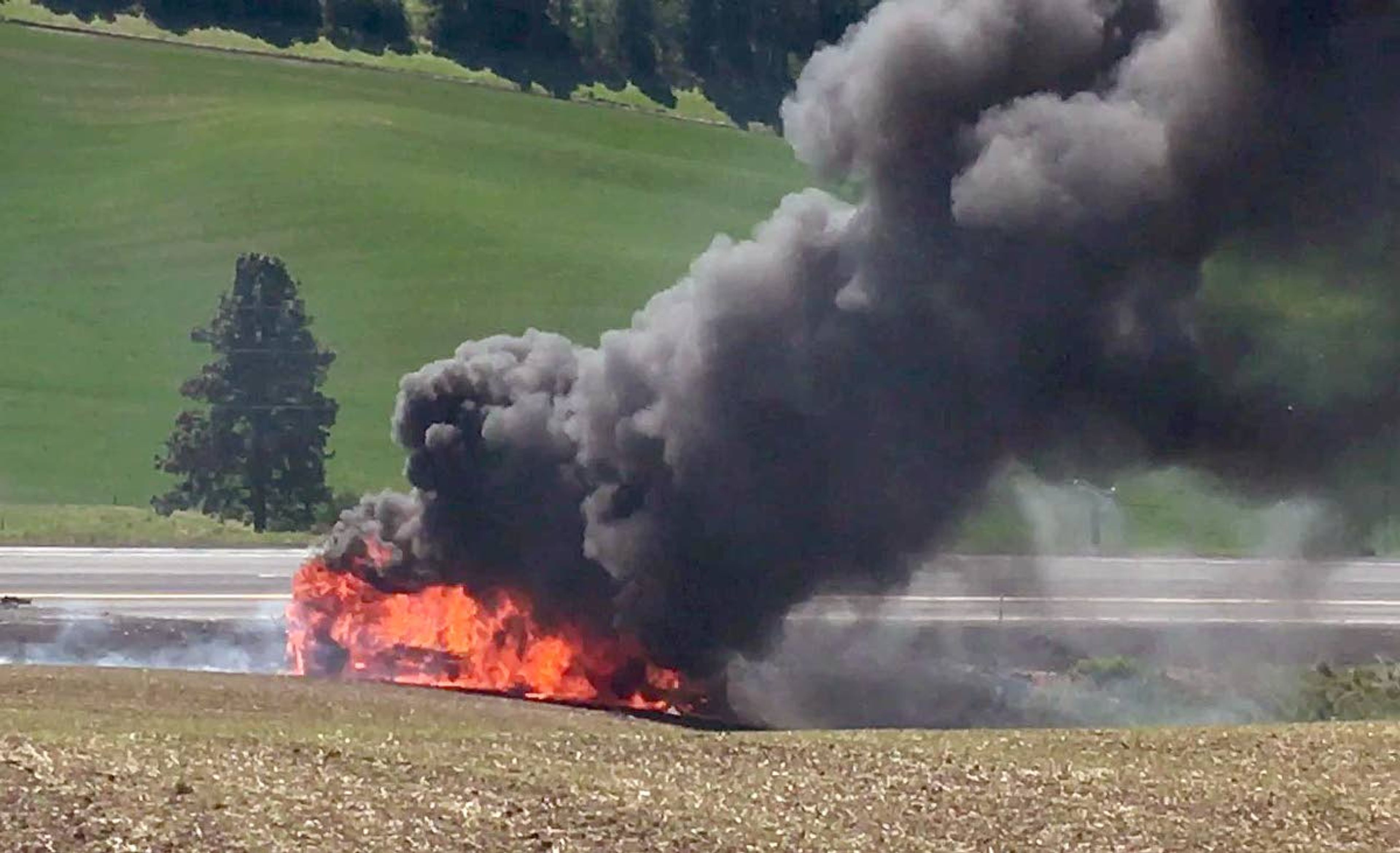 A motorhome is engulfed in flames after catching fire on Saturday U.S. Highway 95 near Viola. The northbound vehicle rolled across the highway and into the ditch after catching fire.