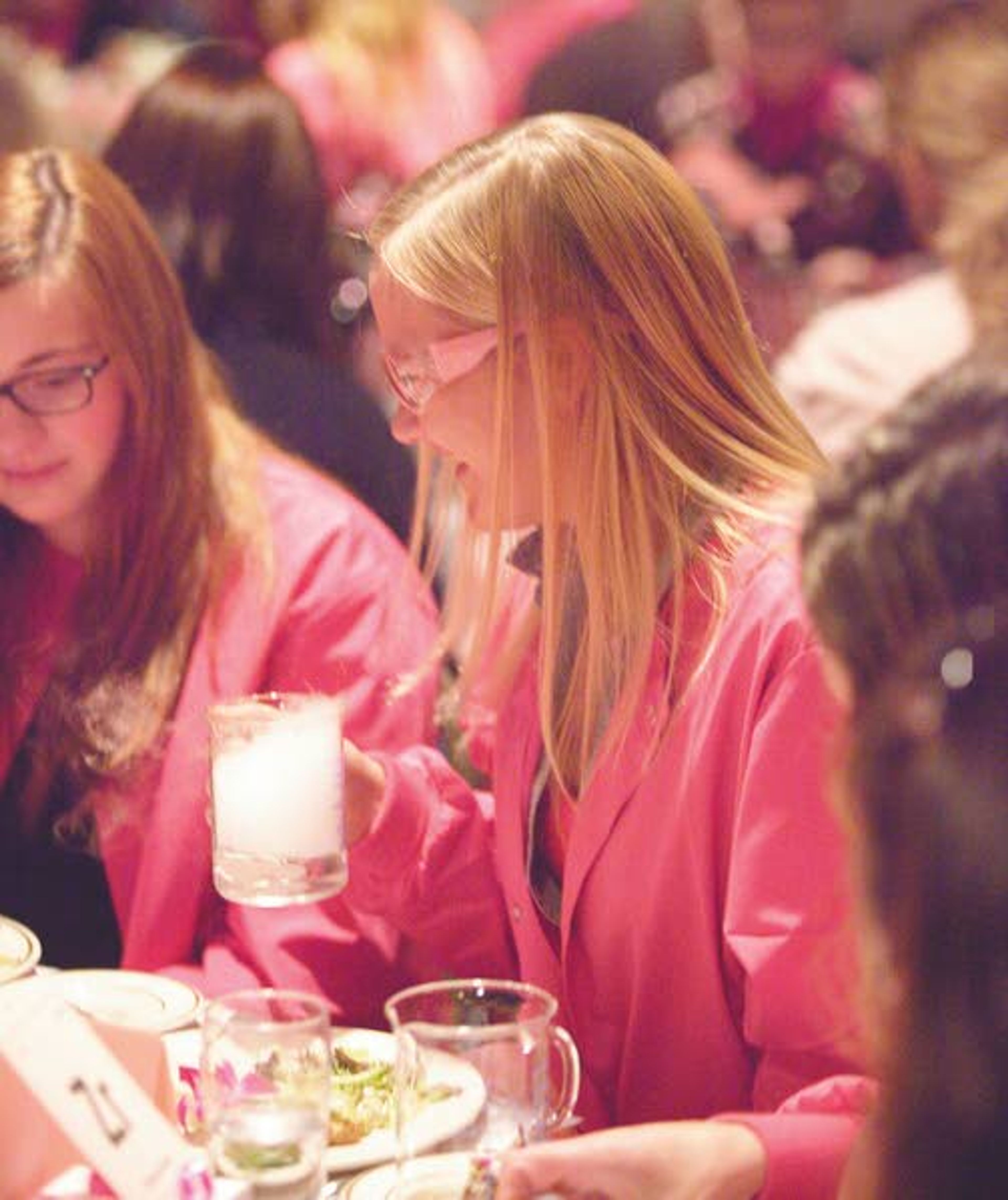 Sarah Vukelich, right, holds a beaker of water and dry ice during the 12th Annual Pink Tea sponsored by Gritman Medical Center on Tuesday at the Best Western Plus University Inn in Moscow. The Pink Tea raises money for the Bosom Buddies program that provides free mammograms at Gritman to those who cannot afford one.