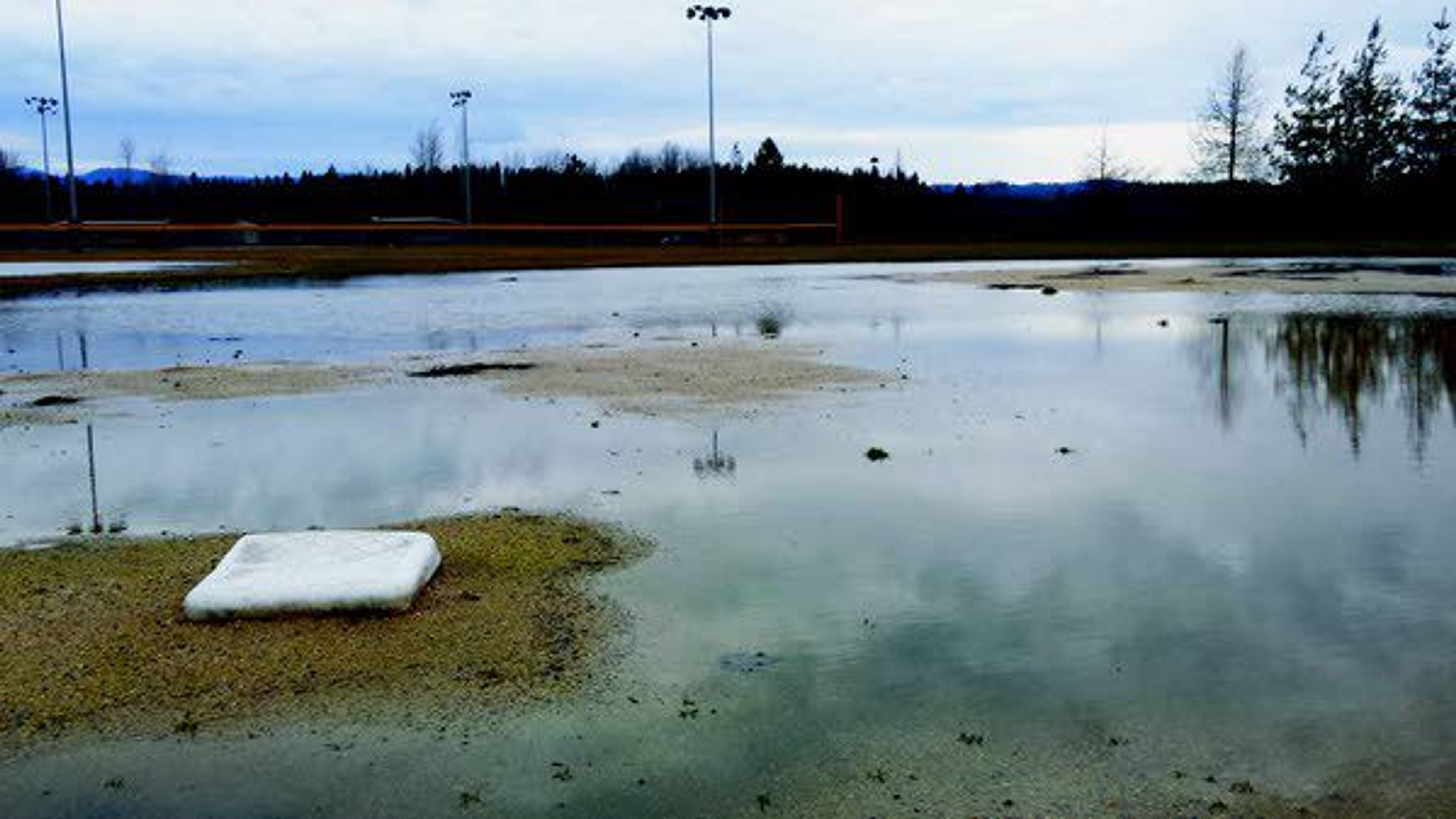 A softball field off state Highway 6 in Potlatch is covered in water.