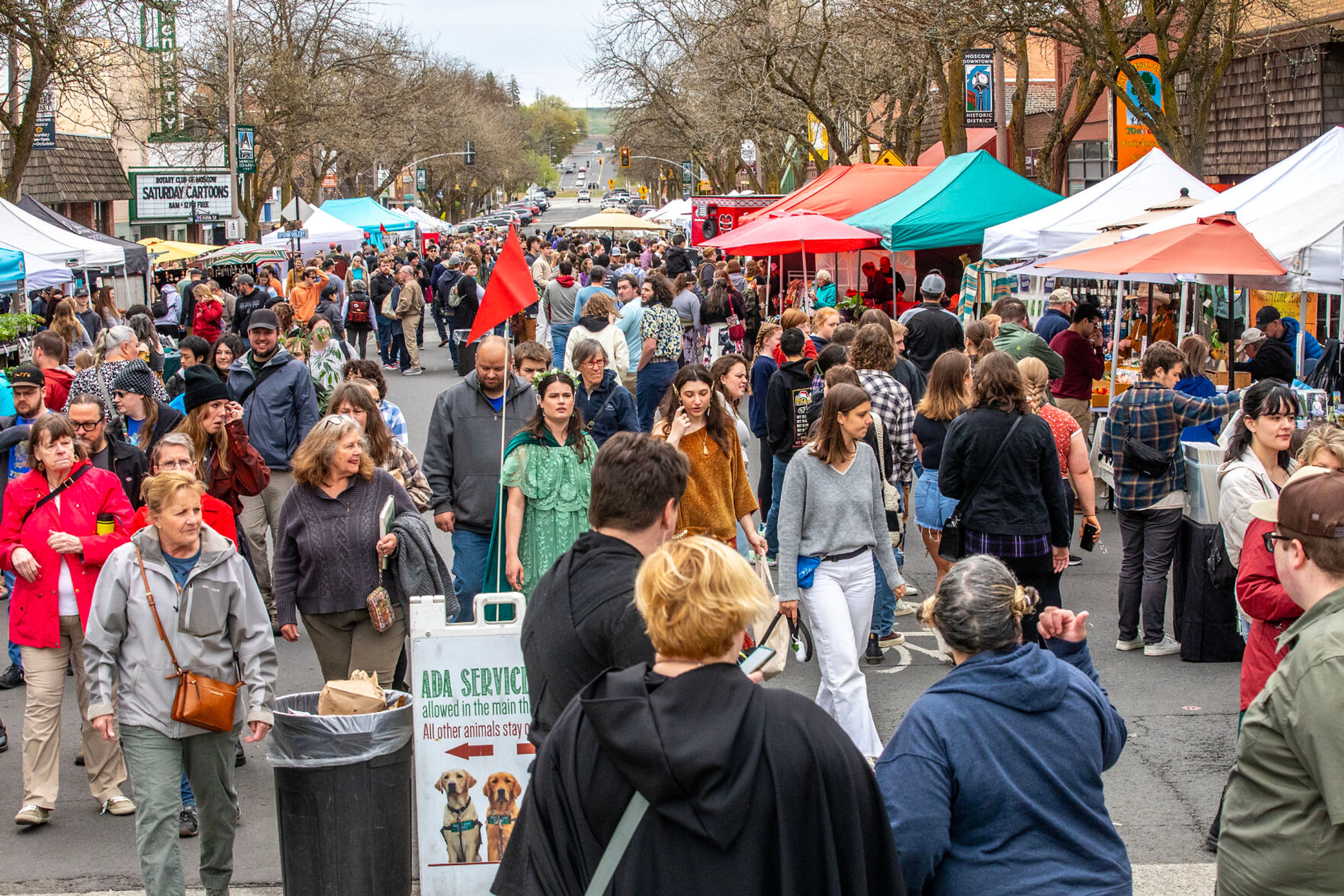 People walk down Main Street at the Moscow Farmers Market Saturday in Moscow.